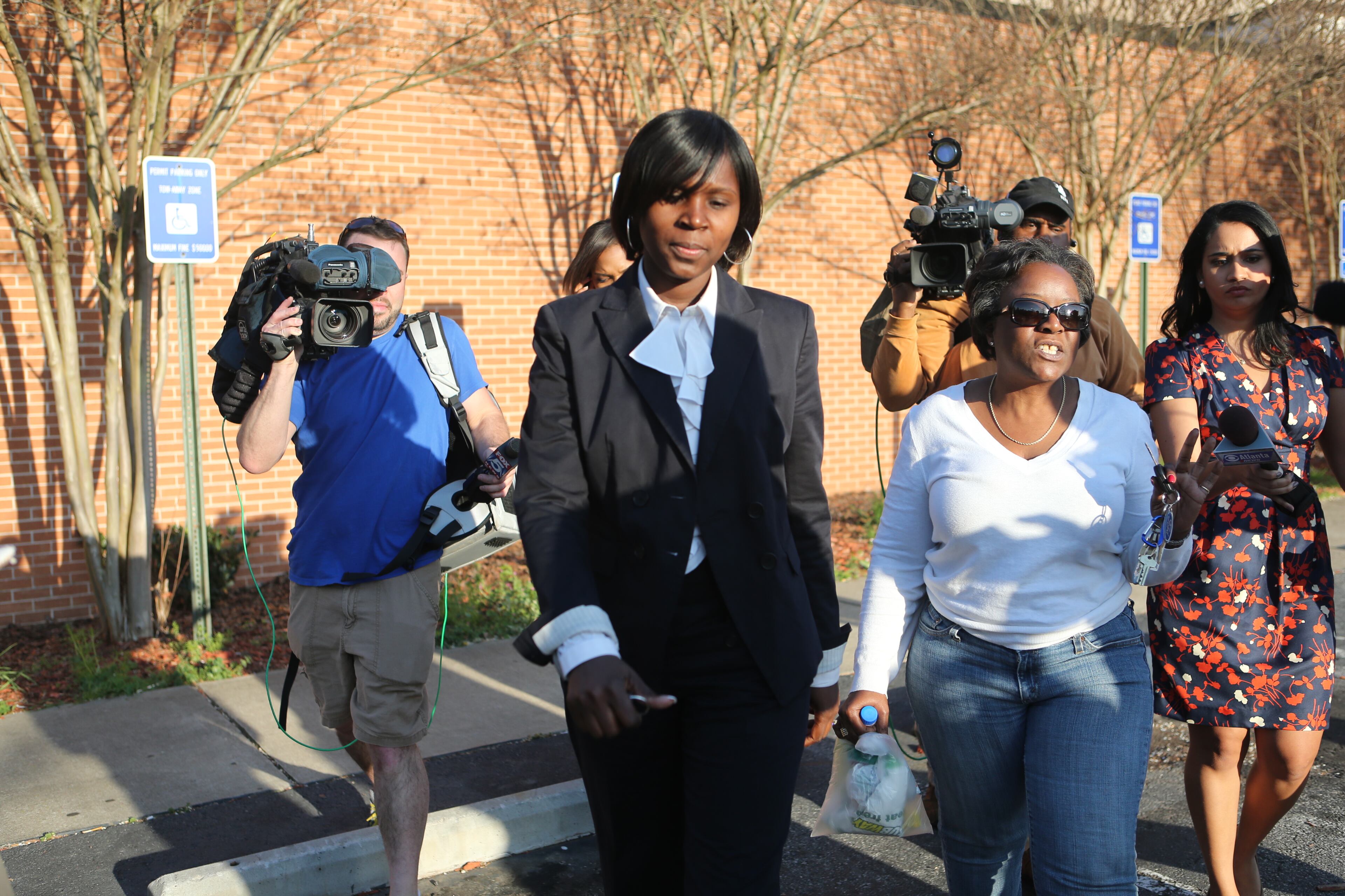 APS educator Sandra Ward (left) is seen leaving the Fulton County Jail on Tuesday, April 2, 2013 after being released on bond. Ward was a testing coordinator at Parks Middle School, is charged with racketeering, falsifying students' answer sheets and theft by taking.