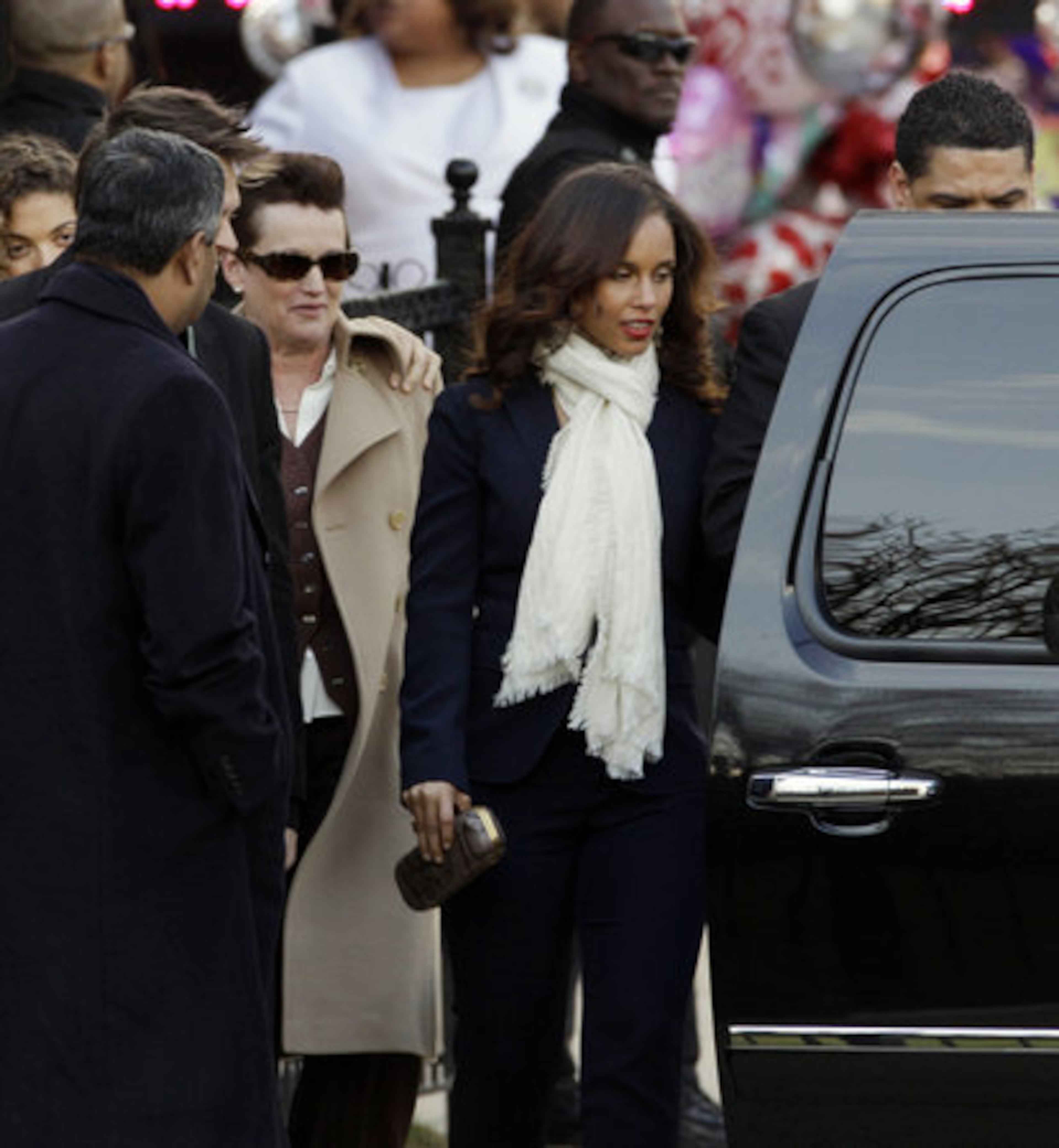 Singer Alicia Keys, center, leaves after a funeral service for Whitney Houston at New Hope Baptist Church in Newark, N.J., Saturday, Feb. 18, 2012.