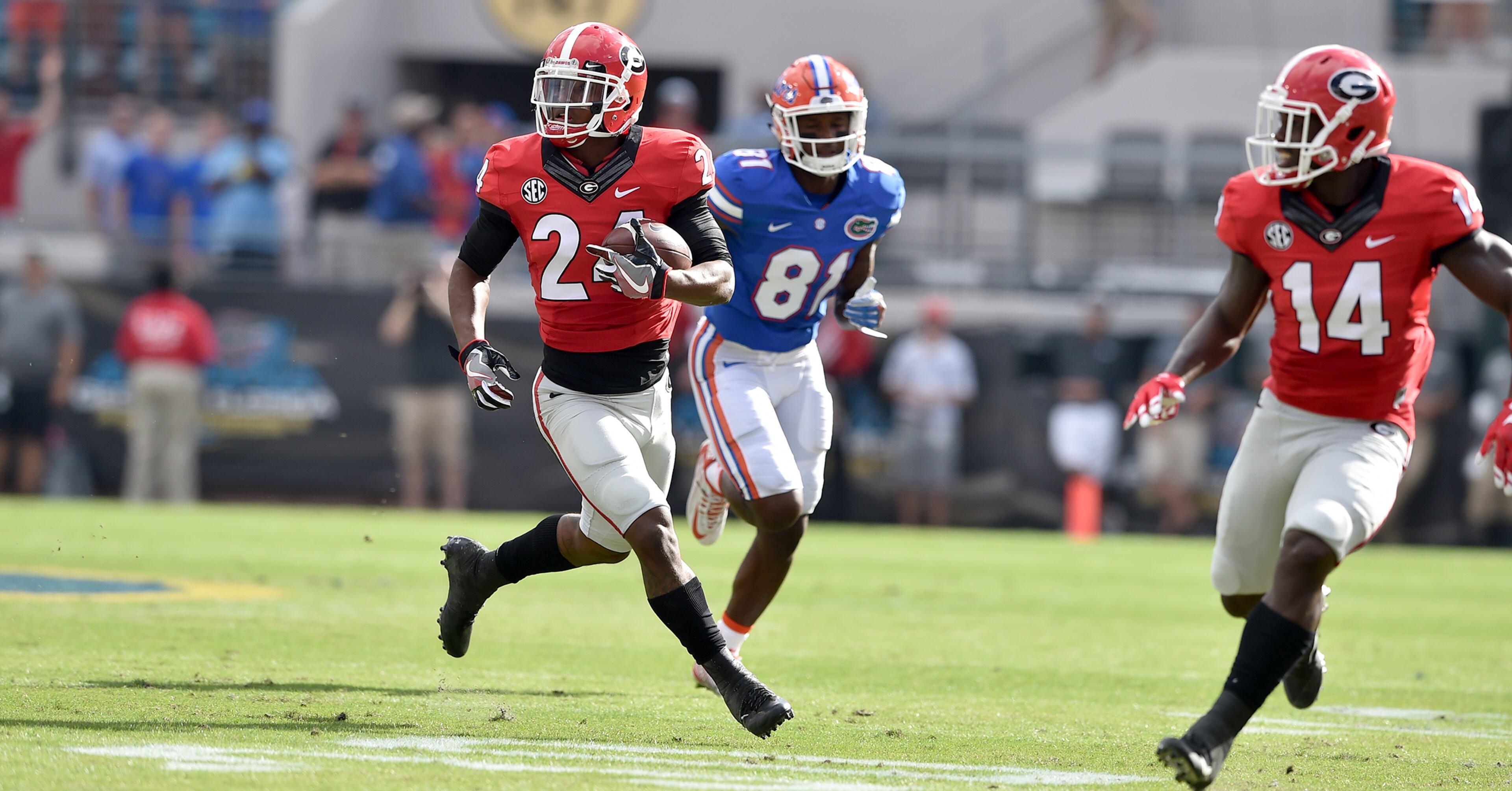 October 29 Jacksonville, FL : Georgia Bulldogs safety Dominick Sanders gains extra yardage after intercepting a Florida Gators pass on the opening drive of the game at EverBank Field in Jacksonville Saturday October 29, 2016. The turnover resulted in a Georgia field goal. BRANT SANDERLIN/BSANDERLIN@AJC.COM