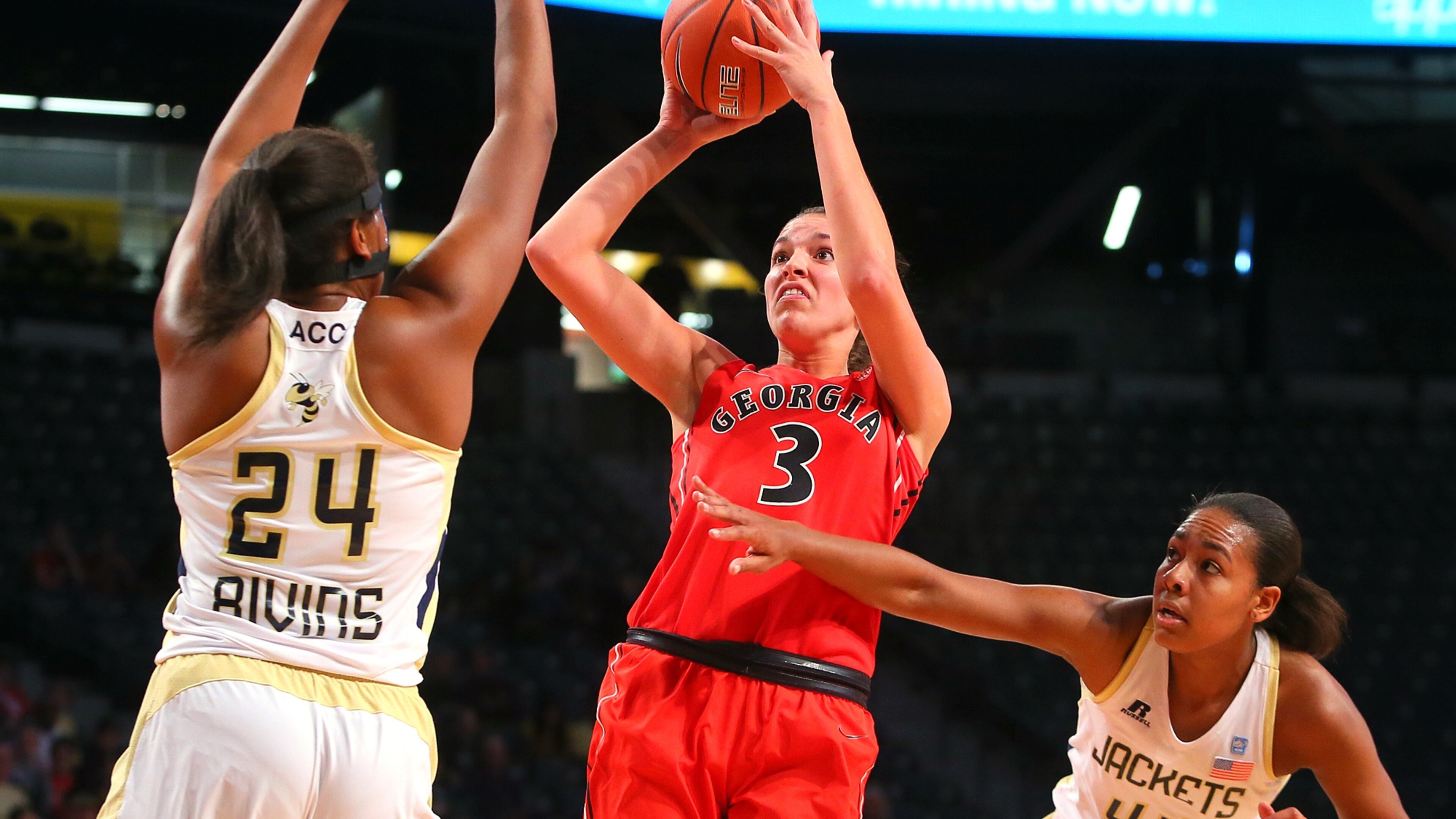 Georgia's Anne Marie Armstrong rises up for a shot against Georgia Tech defenders Shayla Bivins (left) and Jasmine Blain.