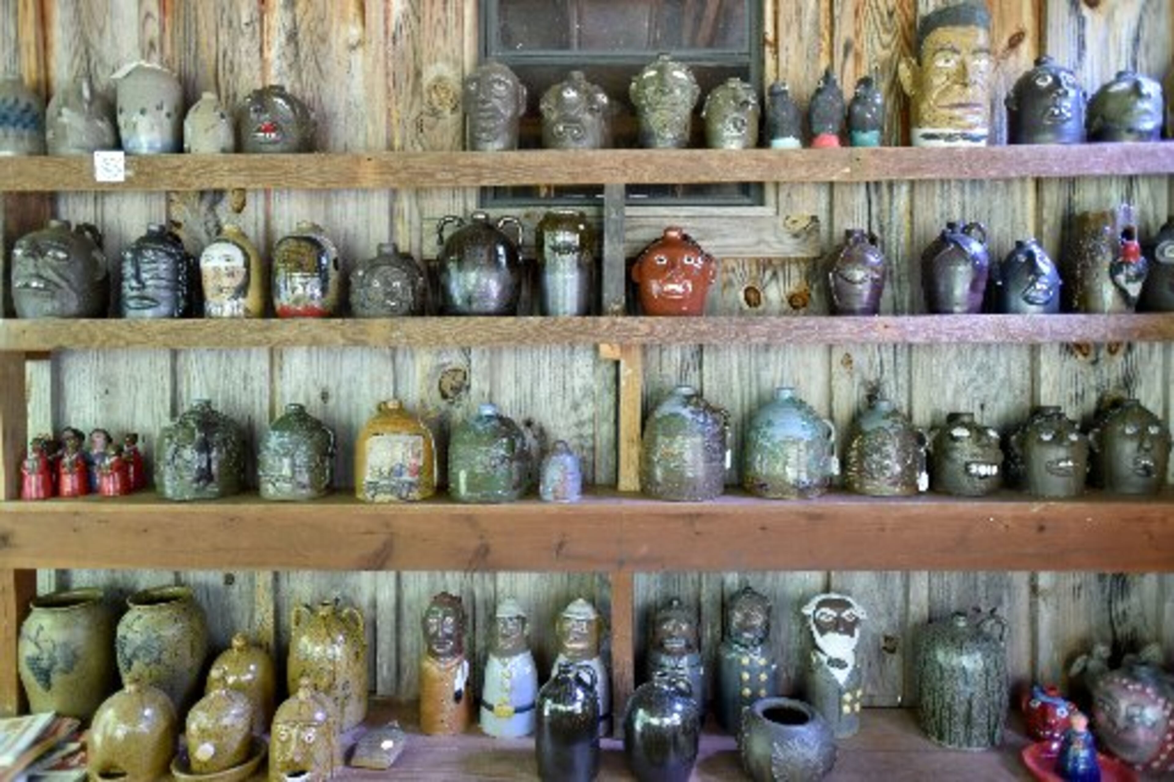 Lining up their creativity: Pottery by Tom and Judy Touchstone is displayed in their gallery in Armuchee, near Summerville. HYOSUB SHIN / HSHIN@AJC.COM