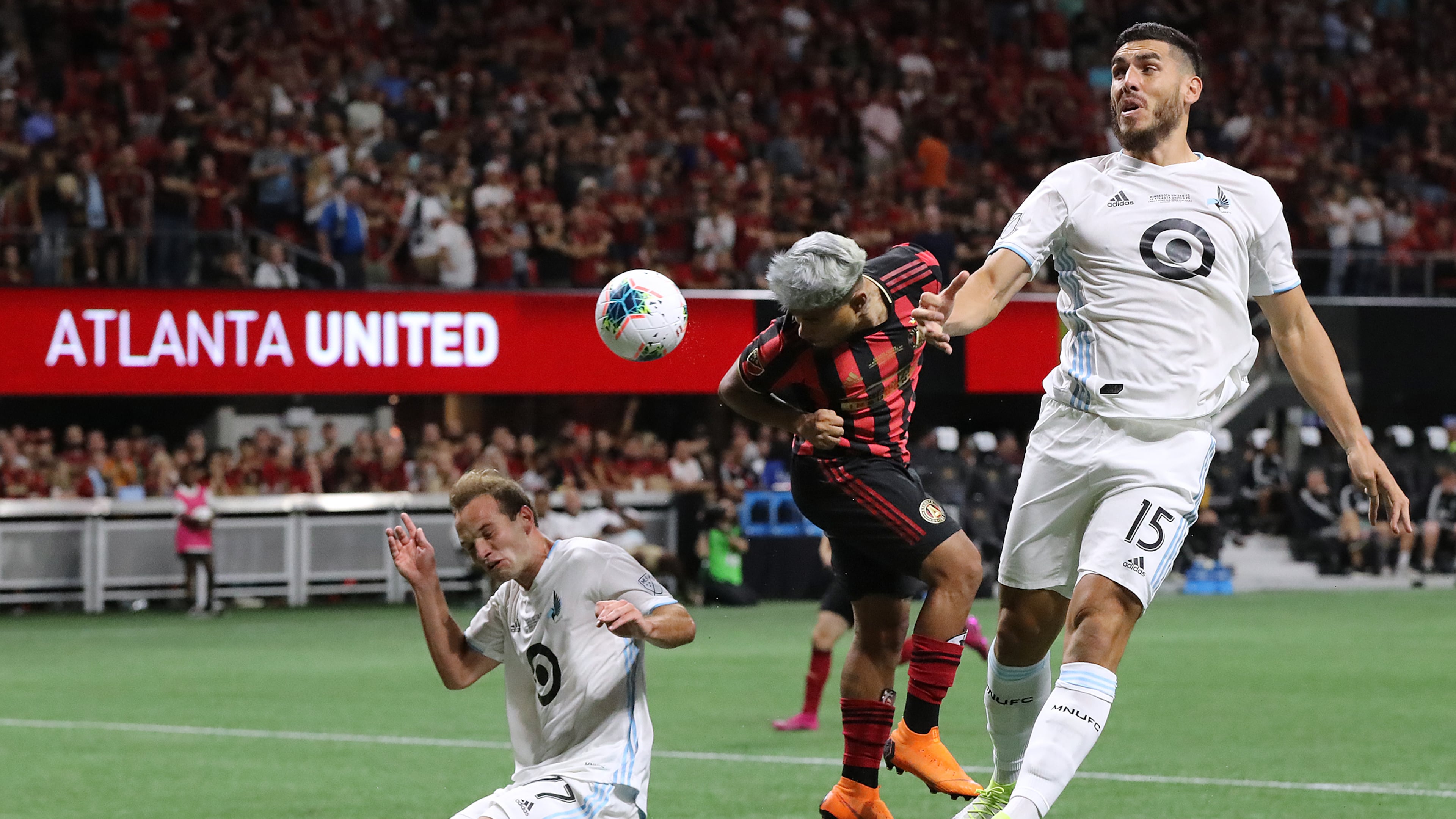 August 27, 2019 Atlanta: Atlanta United forward Josef Martinez misses a header in front of the goal as Minnesota United defenders Chase Gasper (left) and Michael Boxall (right) attempt to block the shot during a 2-1 Atlanta United victory in the U.S. Open Cup on Tuesday, August 27, 2019, in Atlanta. Curtis Compton/ccompton@ajc.com