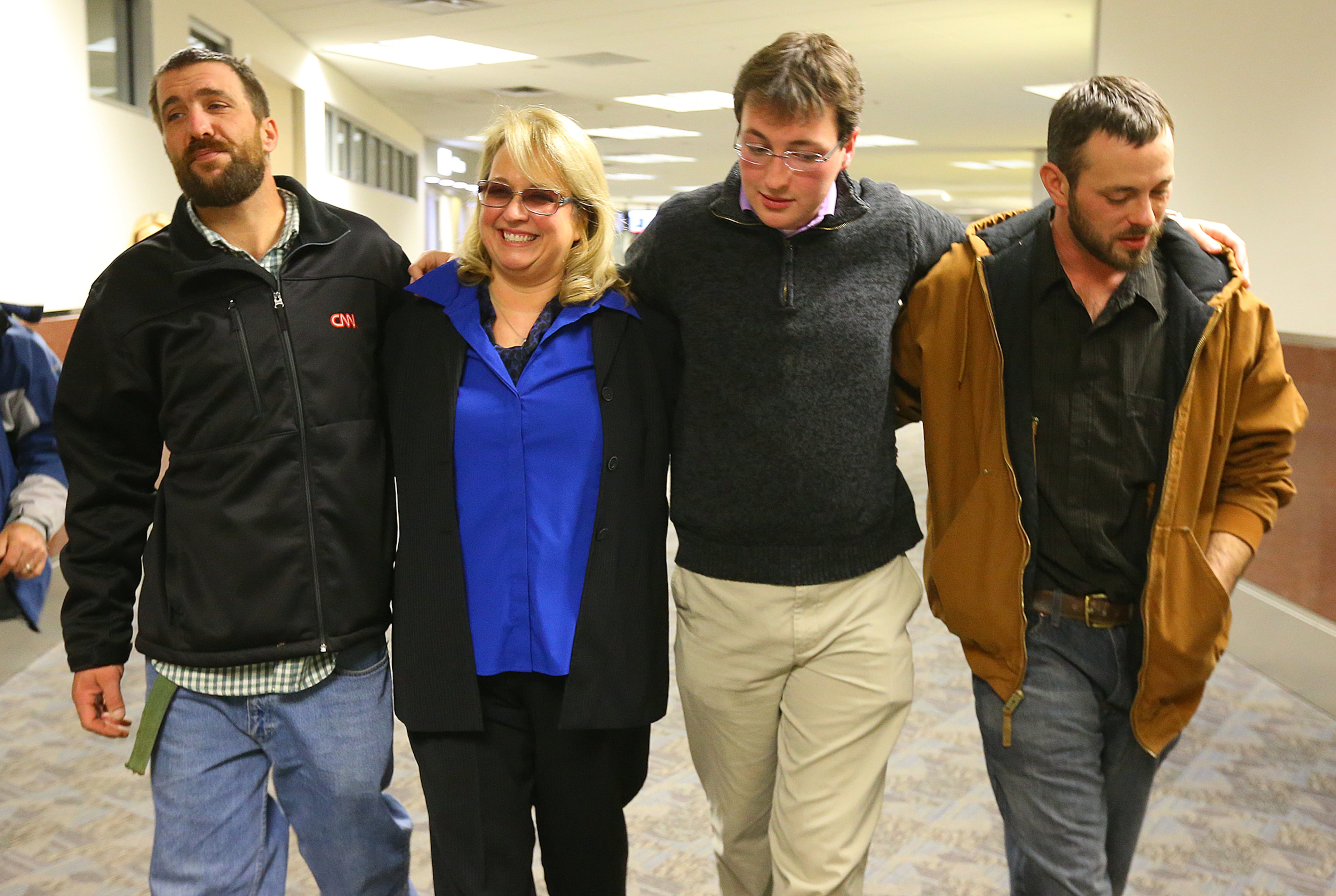 Reunited for Thanksgiving Joel Hartman leaves Hartsfield Jackson Airport with his stepmother Deanna Rodecki, and brothers Andrew Rodecki and Erick Hordos to return to the Omni Hotel at CNN Center on Thursday, Nov. 28, 2013, in Atlanta.