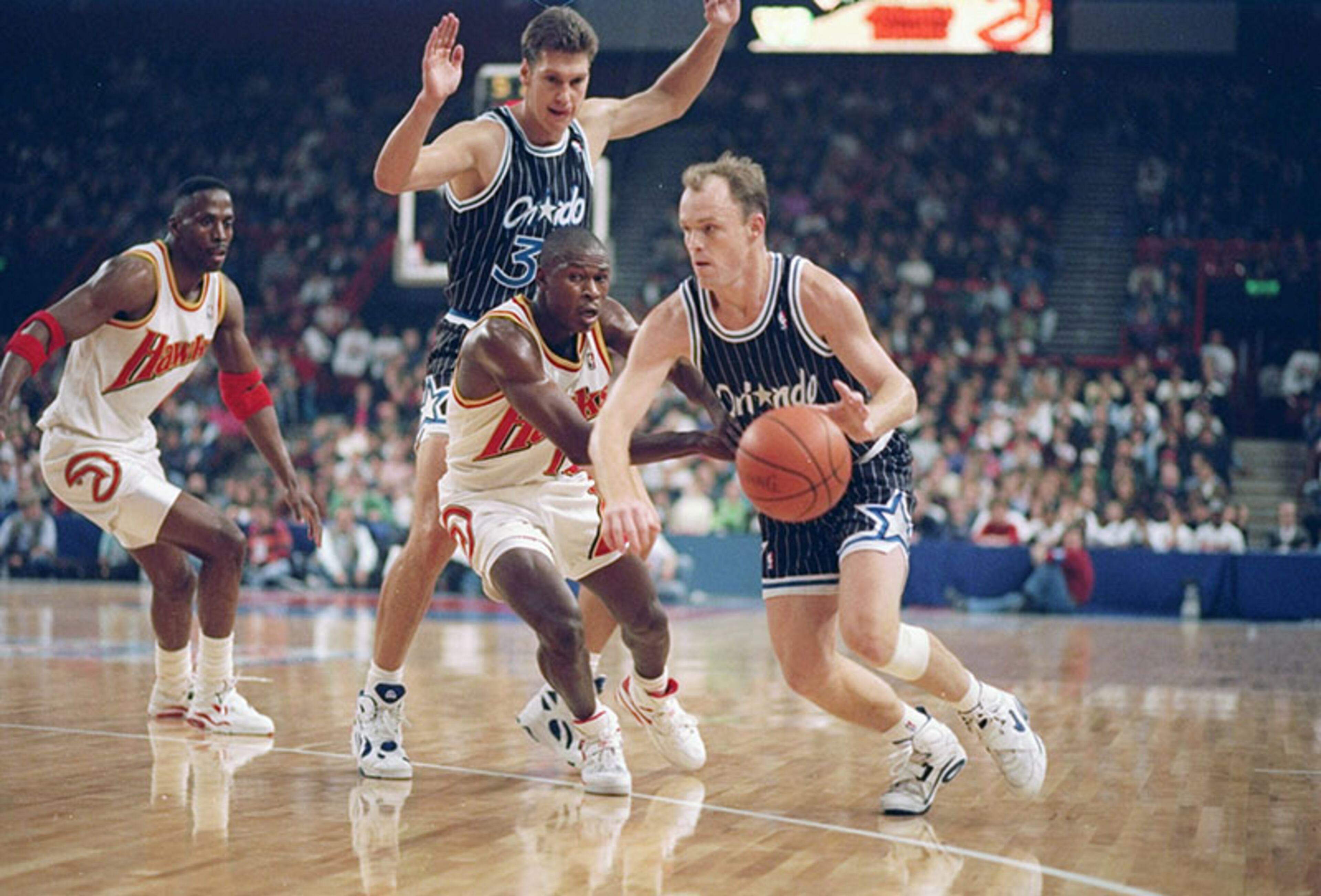 Oct. 31, 1993: Magic guard Scott Skiles drives against the Hawks before a sellout crowd of 9,843 in the second of two preseason games between the Hawks and Magic at London's Wembley Stadium.