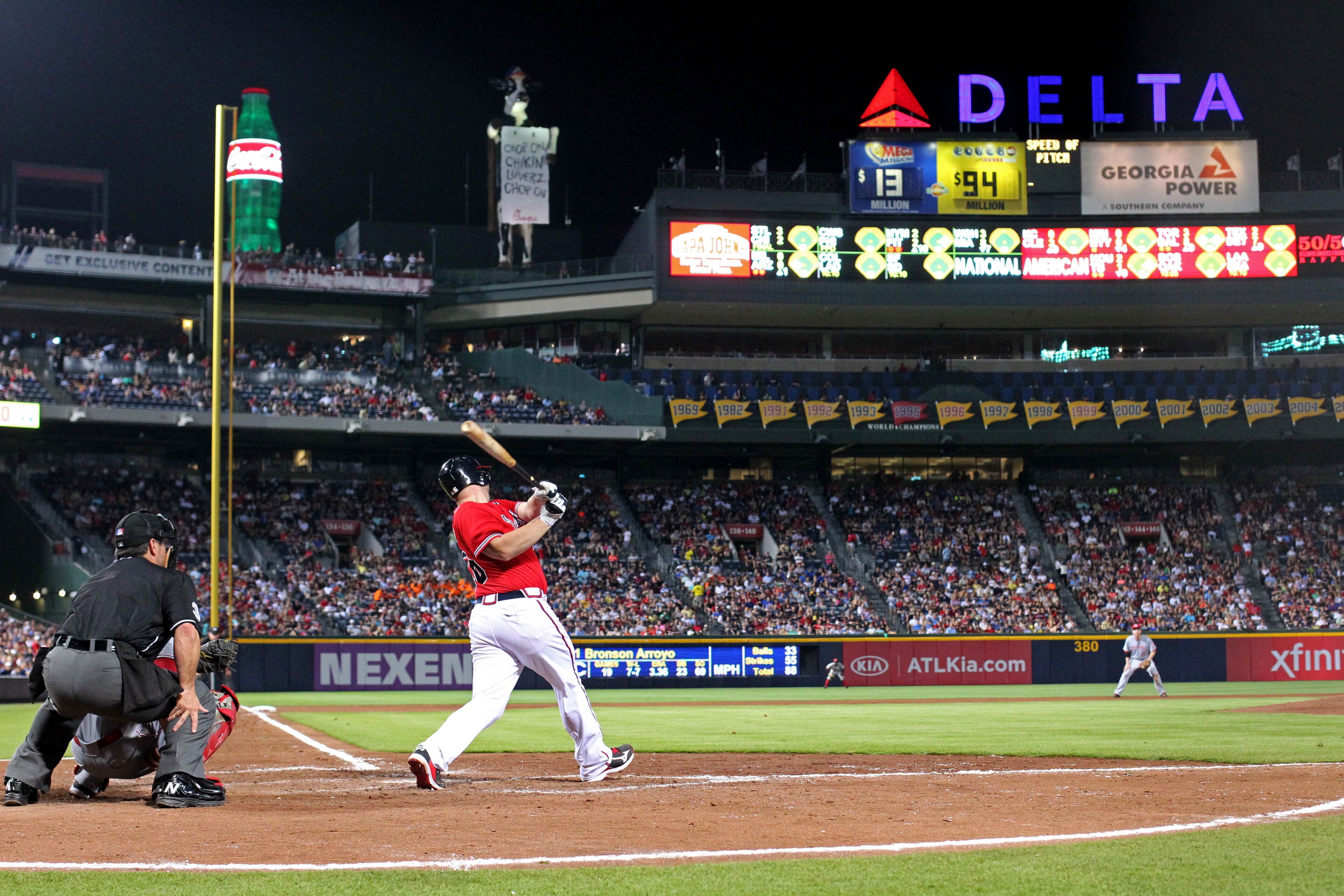 Braves catcher Brian McCann hits a solo home run in the 7th inning of their game against the Cincinnati Reds at Turner Field Friday night in Atlanta, Ga., July 12, 2013. The Reds defeated the Braves 4-2. This is the second of a four game series versus the Cincinnati Reds. JASON GETZ / JGETZ@AJC.COM