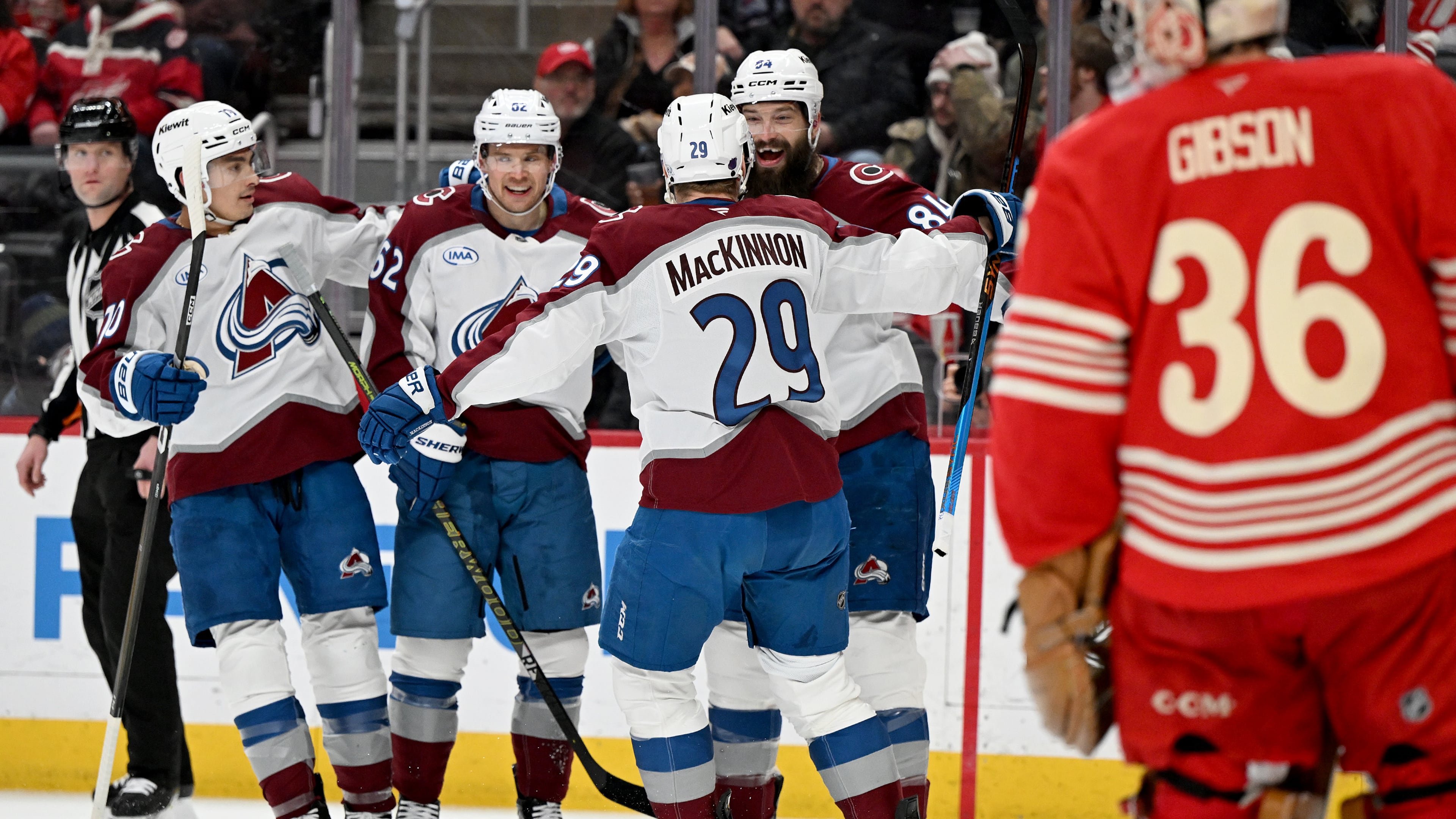 Colorado defenseman Brent Burns (84) celebrates with Colorado defenseman Sam Malinski (70), Colorado left wing Artturi Lehkonen (62) and Colorado center Nathan MacKinnon (29) after scoring a goal against Detroit in the first period of an NHL hockey game Saturday, Jan. 31, 2026 in Detroit. (AP Photo/Lon Horwedel)