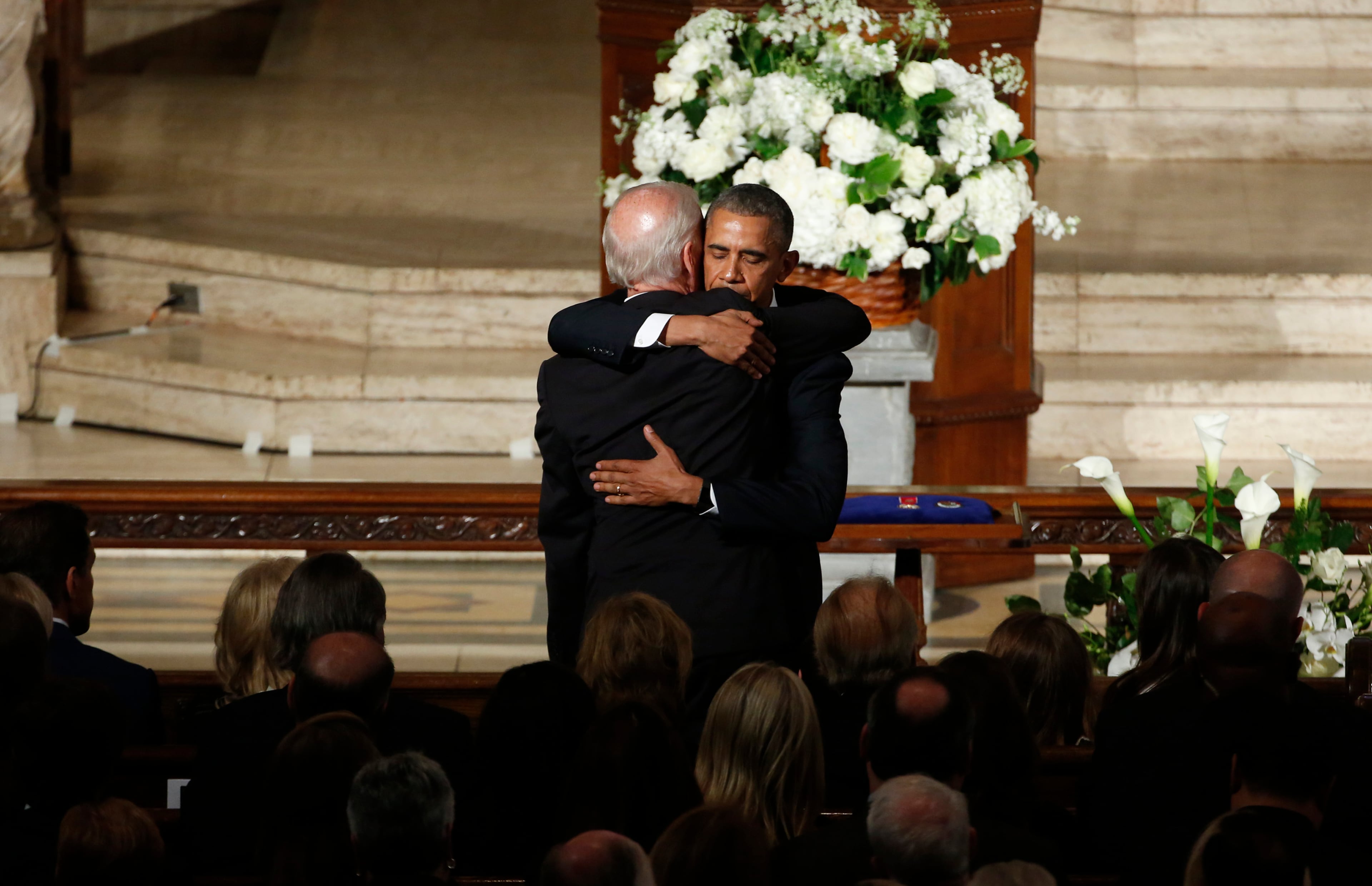 President Barack Obama hugs Vice President Joe Biden during funeral services for Biden's son, Beau Biden, saturday, June 6, 2015, at St. Anthony of Padua Church in Wilmington, Del. Obama delivered the eulogy for Vice President Joe Biden's son, Beau, who lost his battle with brain cancer at age 46. (Yuri Gripas/Pool Photo via AP)