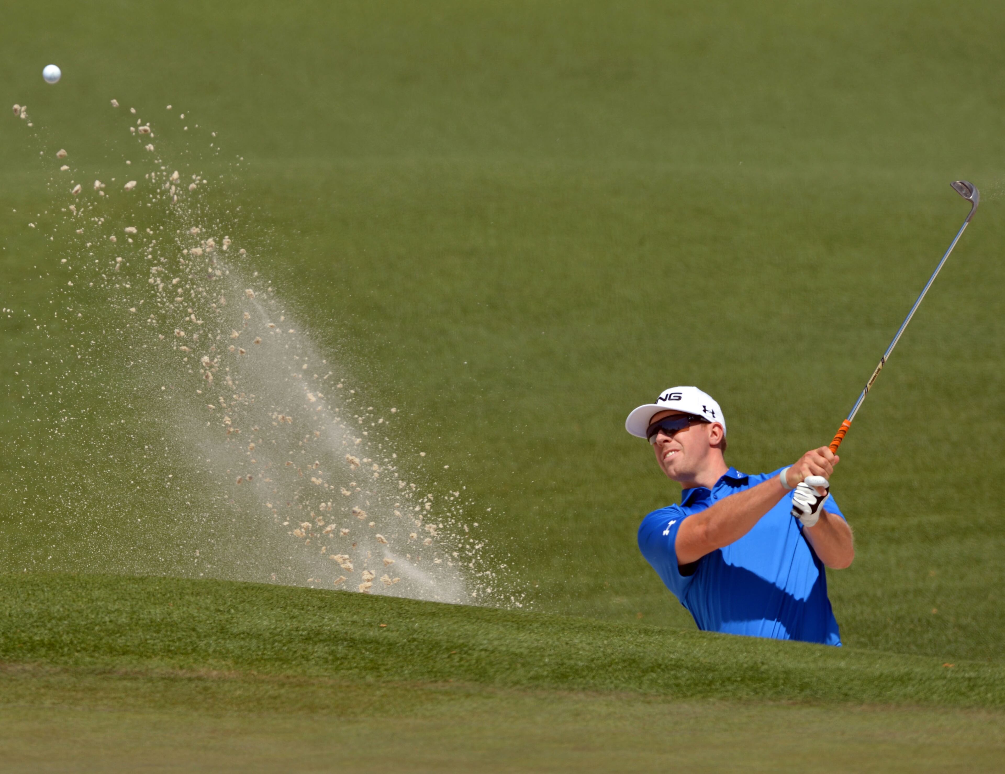 Hunter Mahan hits from the bunker on #2 during the third round of the Masters Tournament Saturday, April 12, 2014, at Augusta National Golf Club.