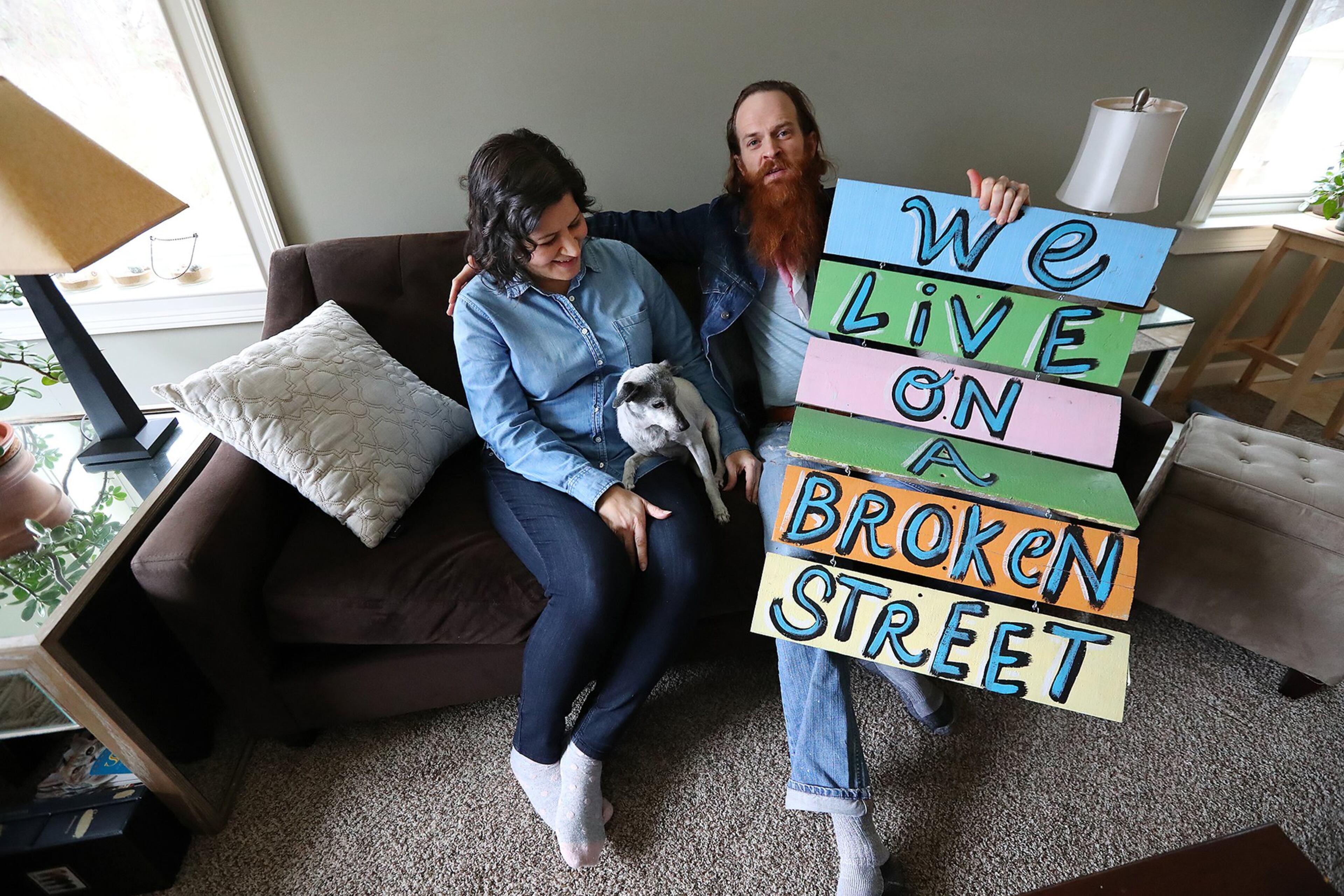 Kyle Brooks at home with his wife, Maria Villamarzo, in 2017. The couple live in Lithonia with their 16-month-old son, Teddy. CURTIS COMPTON / CCOMPTON@AJC.COM