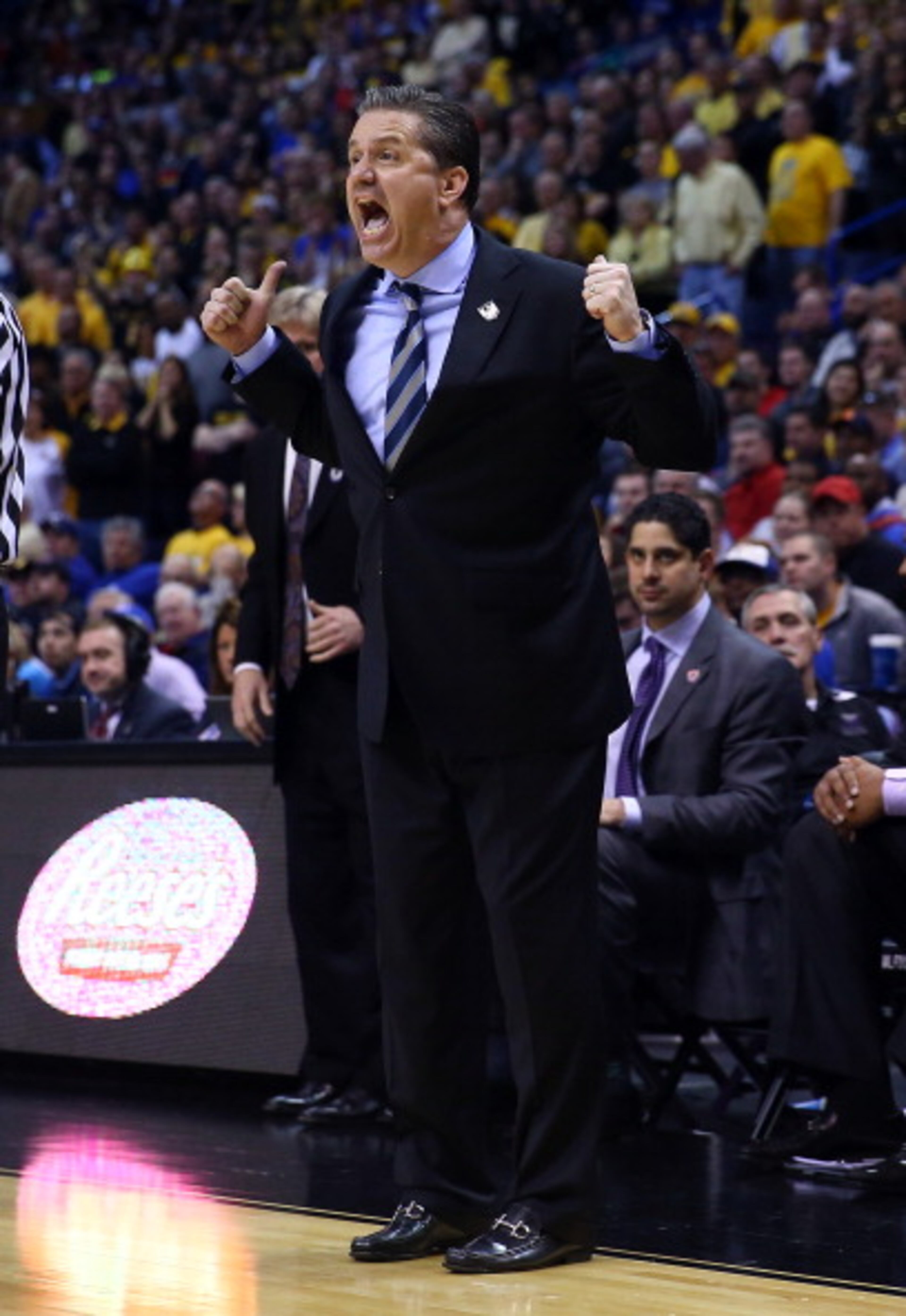 ST LOUIS, MO - MARCH 23: Head coach John Calipari of the Kentucky Wildcats gives instructions to his team against the Wichita State Shockers during the third round of the 2014 NCAA Men's Basketball Tournament at Scottrade Center on March 23, 2014 in St Louis, Missouri. (Photo by Andy Lyons/Getty Images)