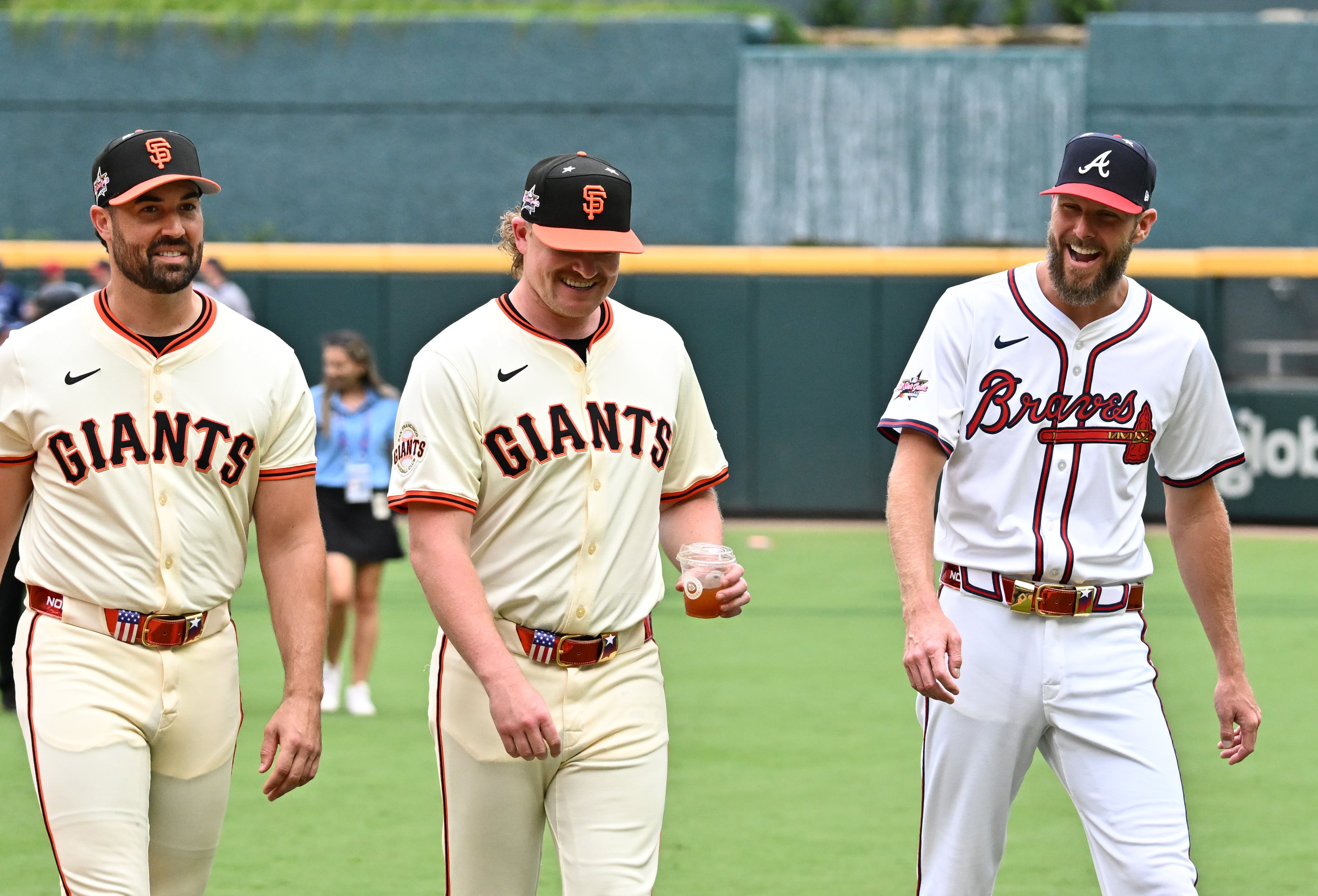Atlanta Braves pitcher Chris Sale (right) talks with San Francisco Giants players Robbie Ray (left) and Logan Webb before the 2025 MLB All-Star Game at Truist Park, Tuesday, July 15, 2025, in Atlanta. (Hyosub Shin/AJC)