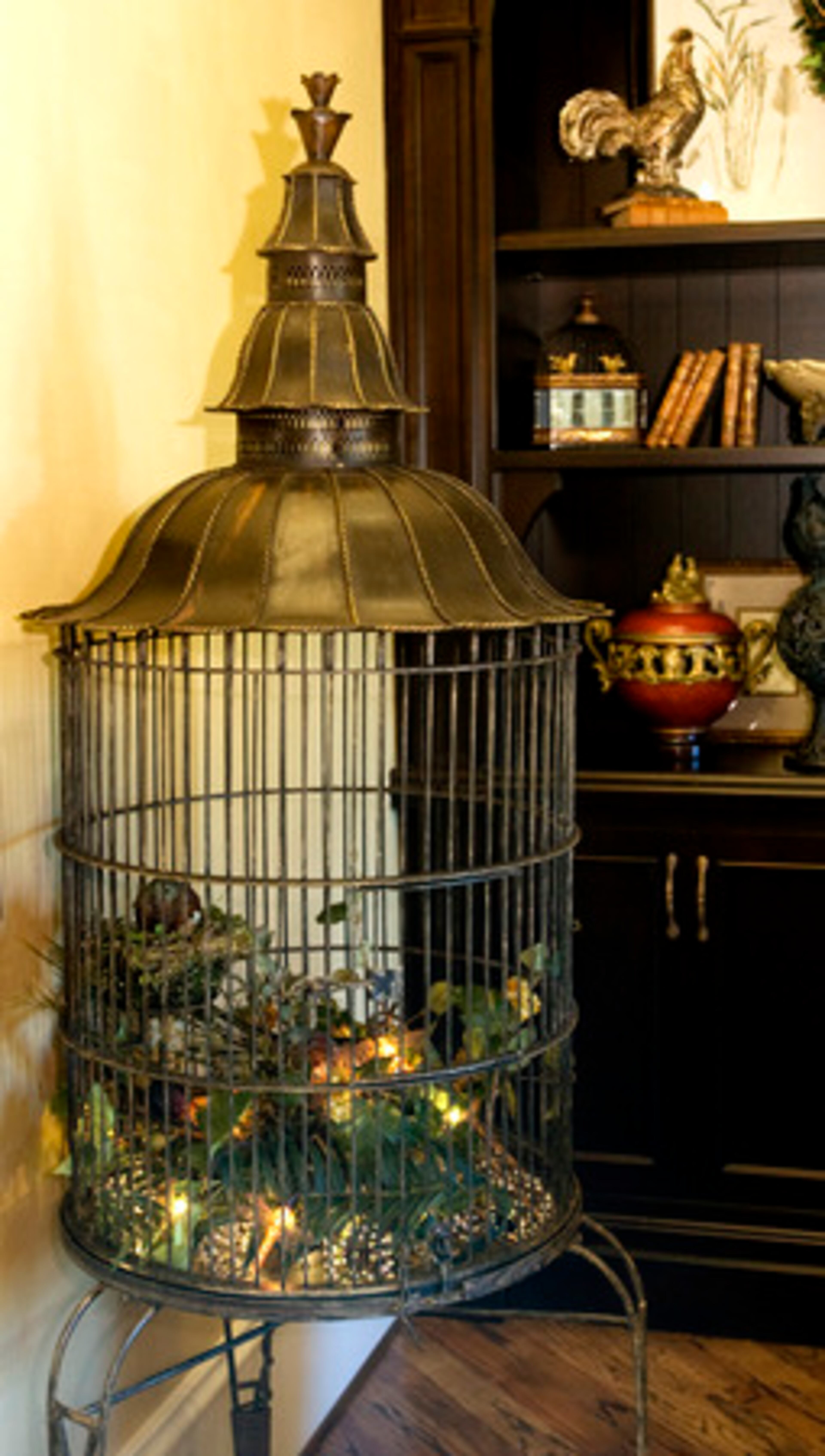 A bird cage in the keeping room of Vickery Manor, which was designed by the Home Fashion Center.