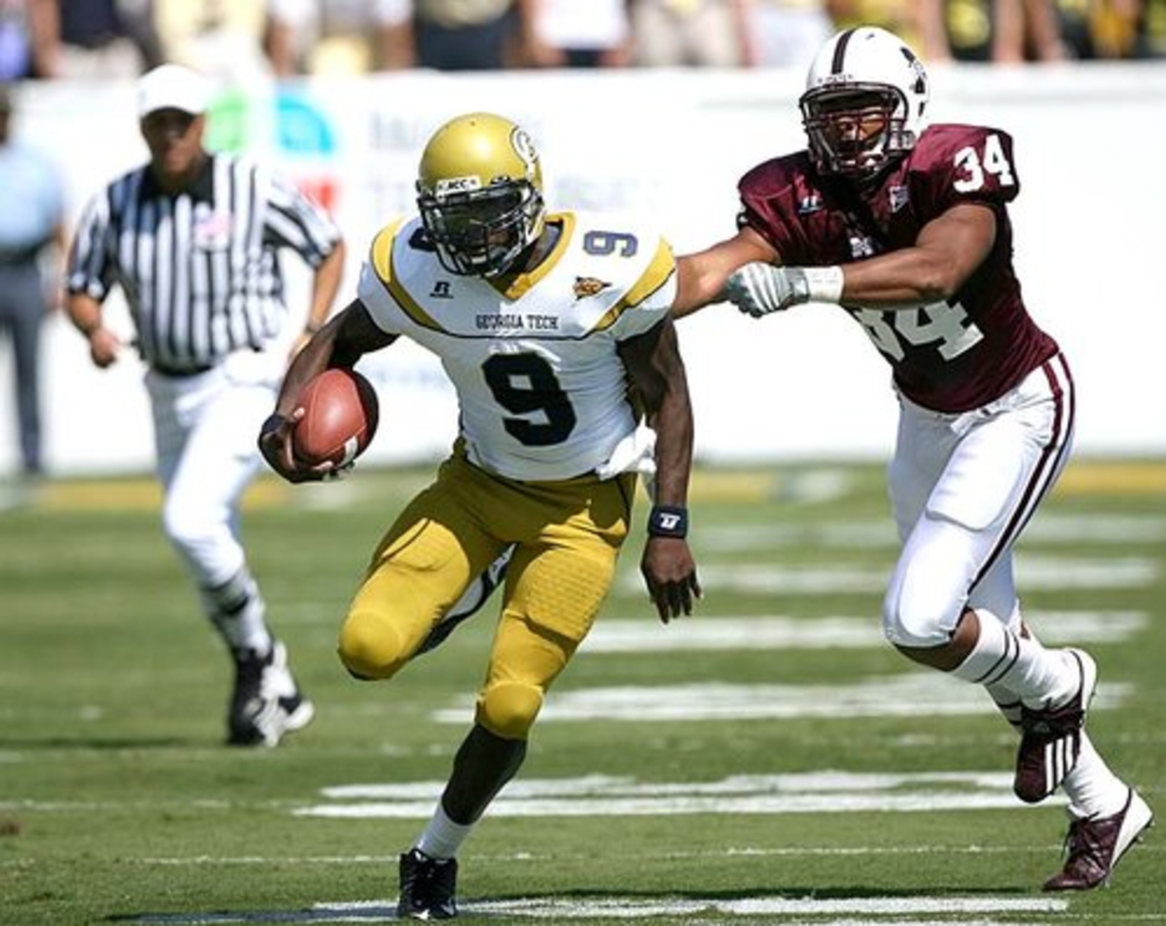 Georgia Tech quarterback Josh Nesbitt gets away from Mississippi State's K.J Wright at Bobby Dodd Stadium in the first quarter. Nesbitt hurt himself on the play and left the game.