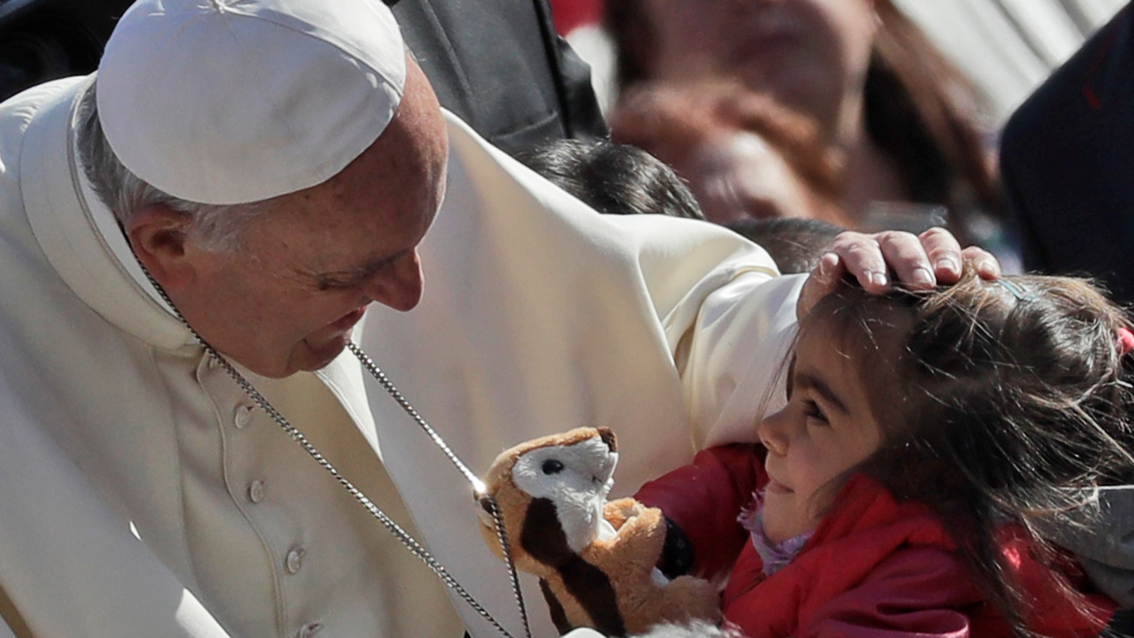 Pope Francis caresses a child during his weekly general audience, in St. Peter’s Square, at the Vatican in 2016. (AP Photo/Alessandra Tarantino)