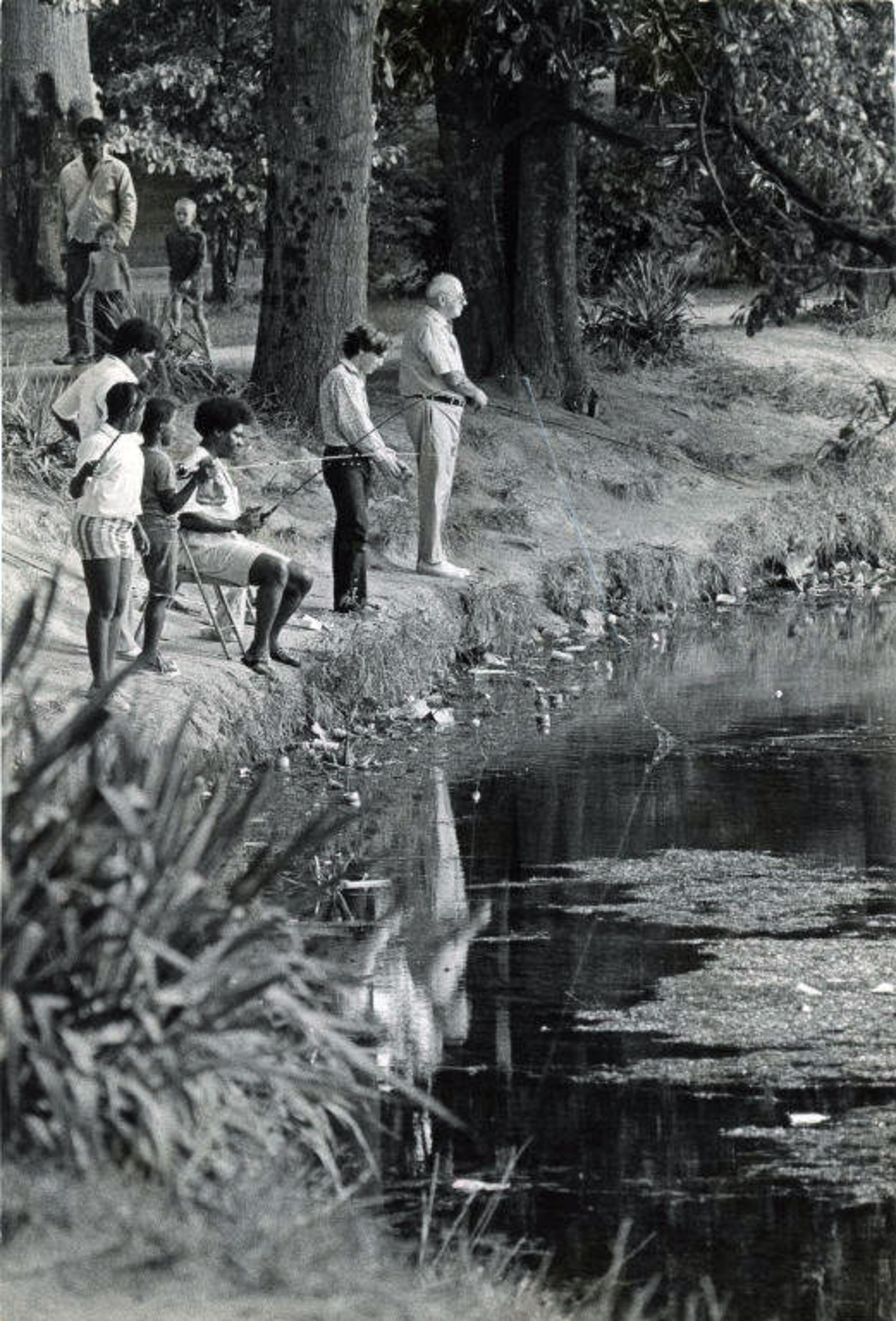 During a heat wave, folks went fishing in the lake at Piedmont Park on Aug. 15, 1972.
