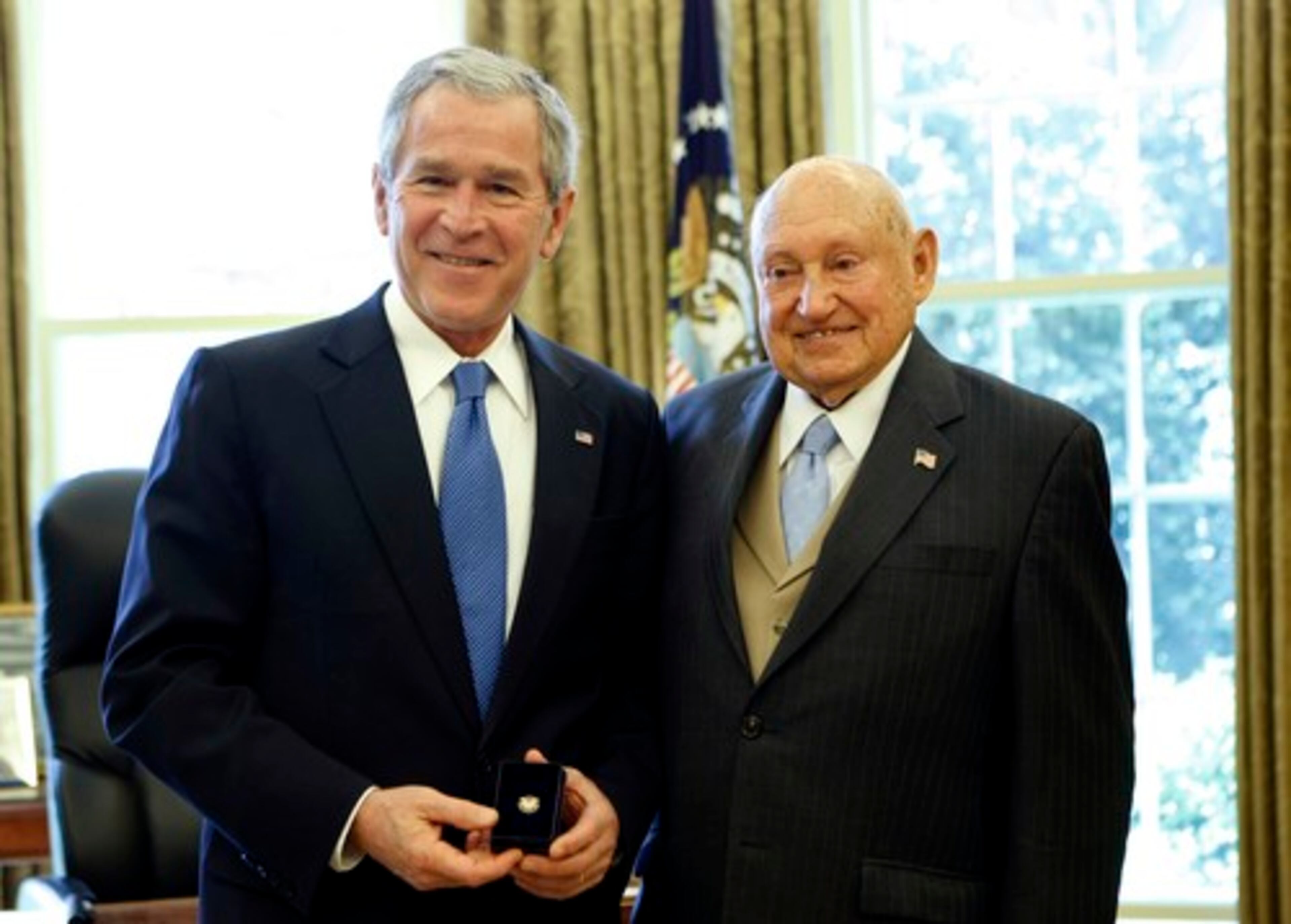 President Bush presents the Lifetime President's Volunteer Service Award to Chick-fil-A, Inc. founder Truett Cathy in April 2008.