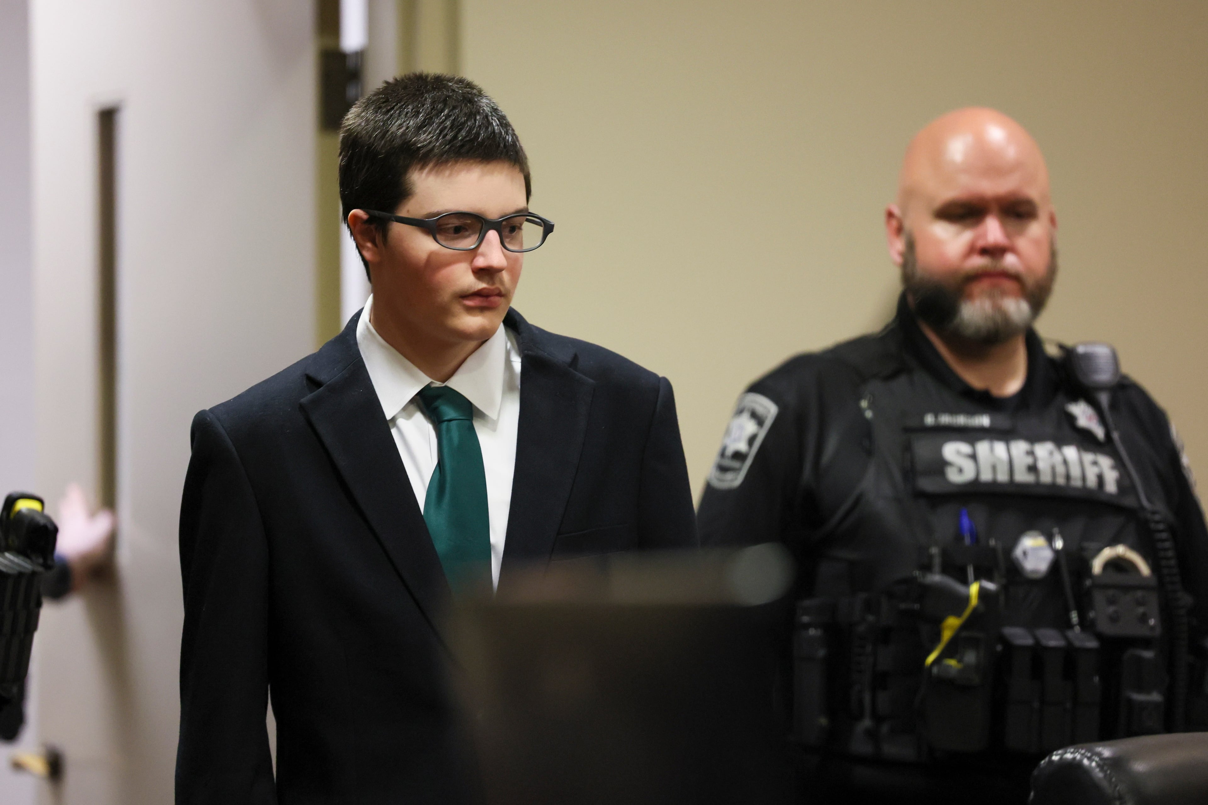 Colt Gray, the 16-year-old who pleaded guilty in the Apalachee High School shooting, is led in to court for his sentencing hearing Monday, July 27, 2026. (Jason Getz/AJC)