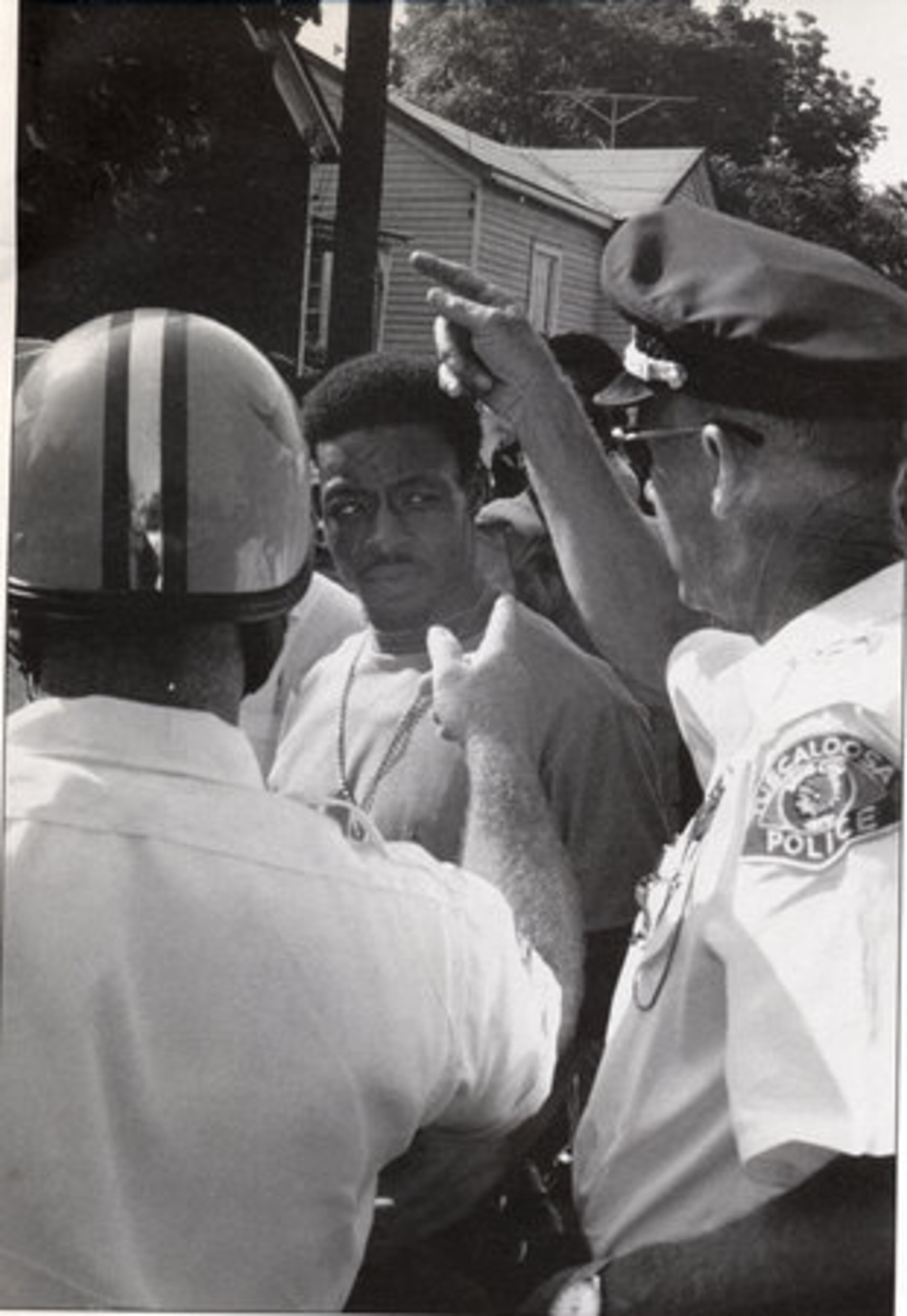 Rev. William Bolden (center) conferring with Tuscaloosa police. Photo Courtesy of Rev. William Bolden.