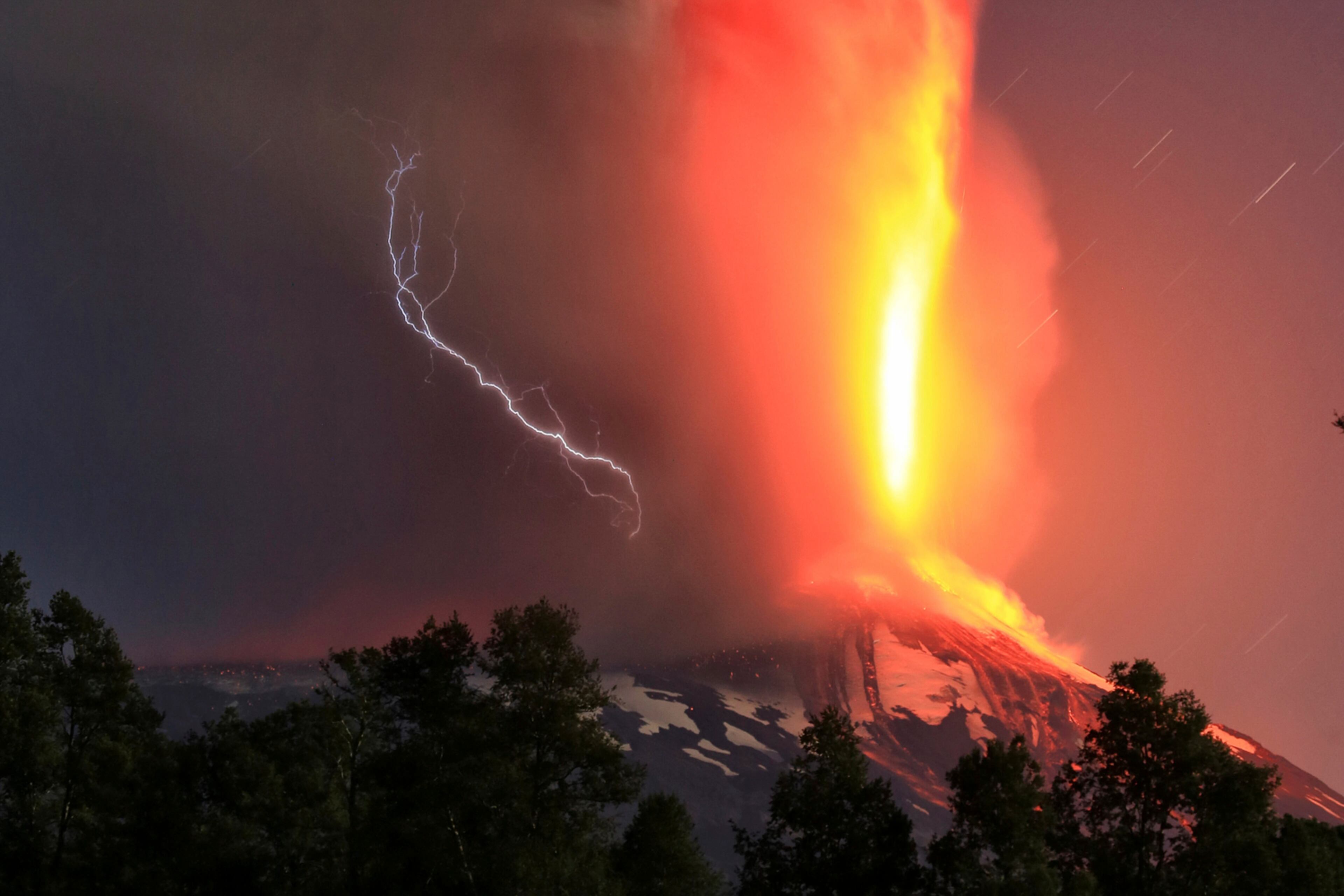 CHILE VOLCANO--The Villarica volcano erupts near Pucon, Chile, early Tuesday, March 3, 2015. The Villarica volcano erupted Tuesday around 3 a.m. local time (0600 GMT), according to the National Emergency Office, which issued a red alert and ordered evacuations. (AP Photo/ Aton Chile)