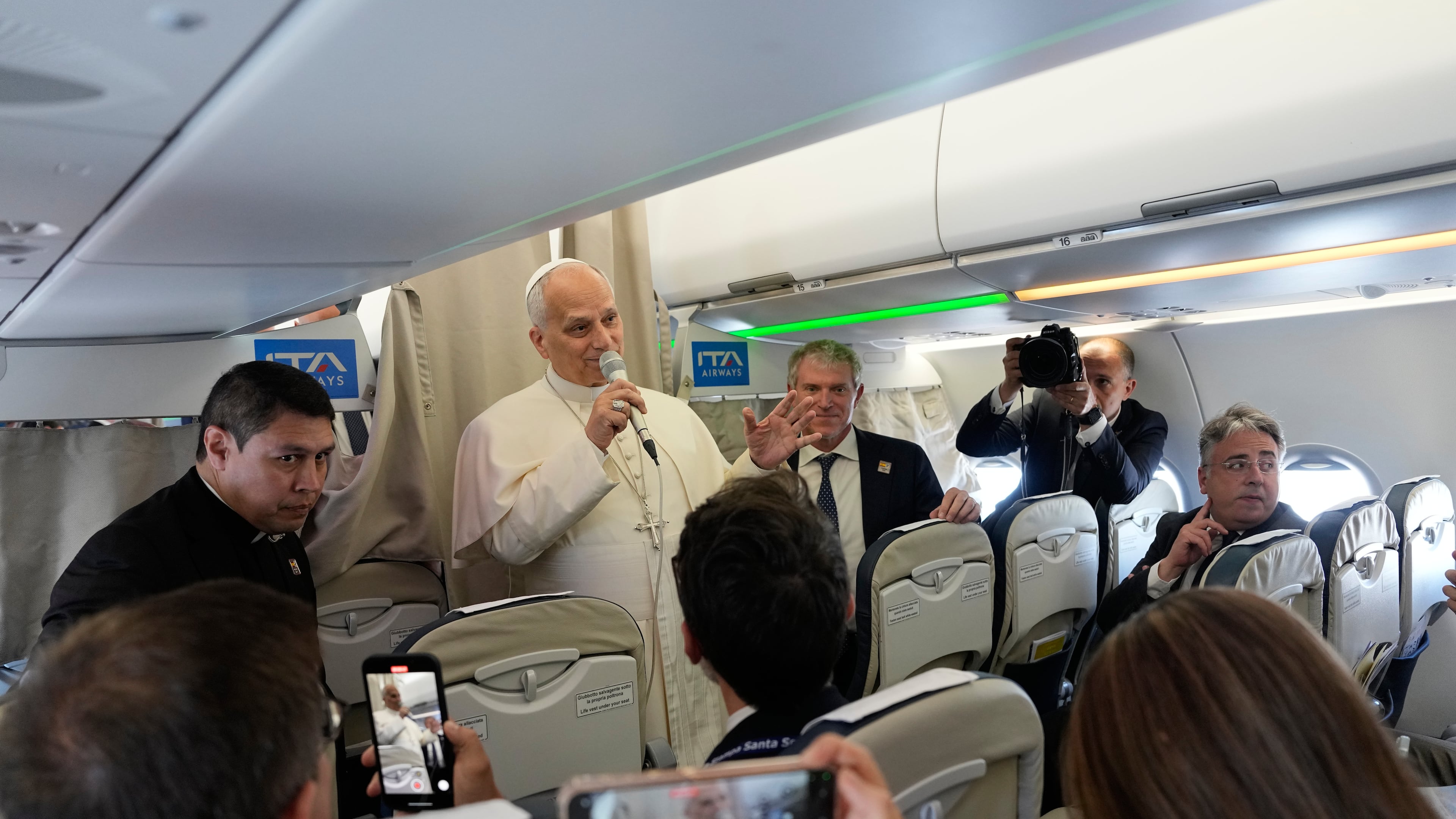 Pope Leo XIV talks to journalists aboard the papal flight from Rome to Madrid, Saturday, June 6, 2026, on the occasion of his apostolic journey to Spain. (AP Photo/Alessandra Tarantino, Pool)