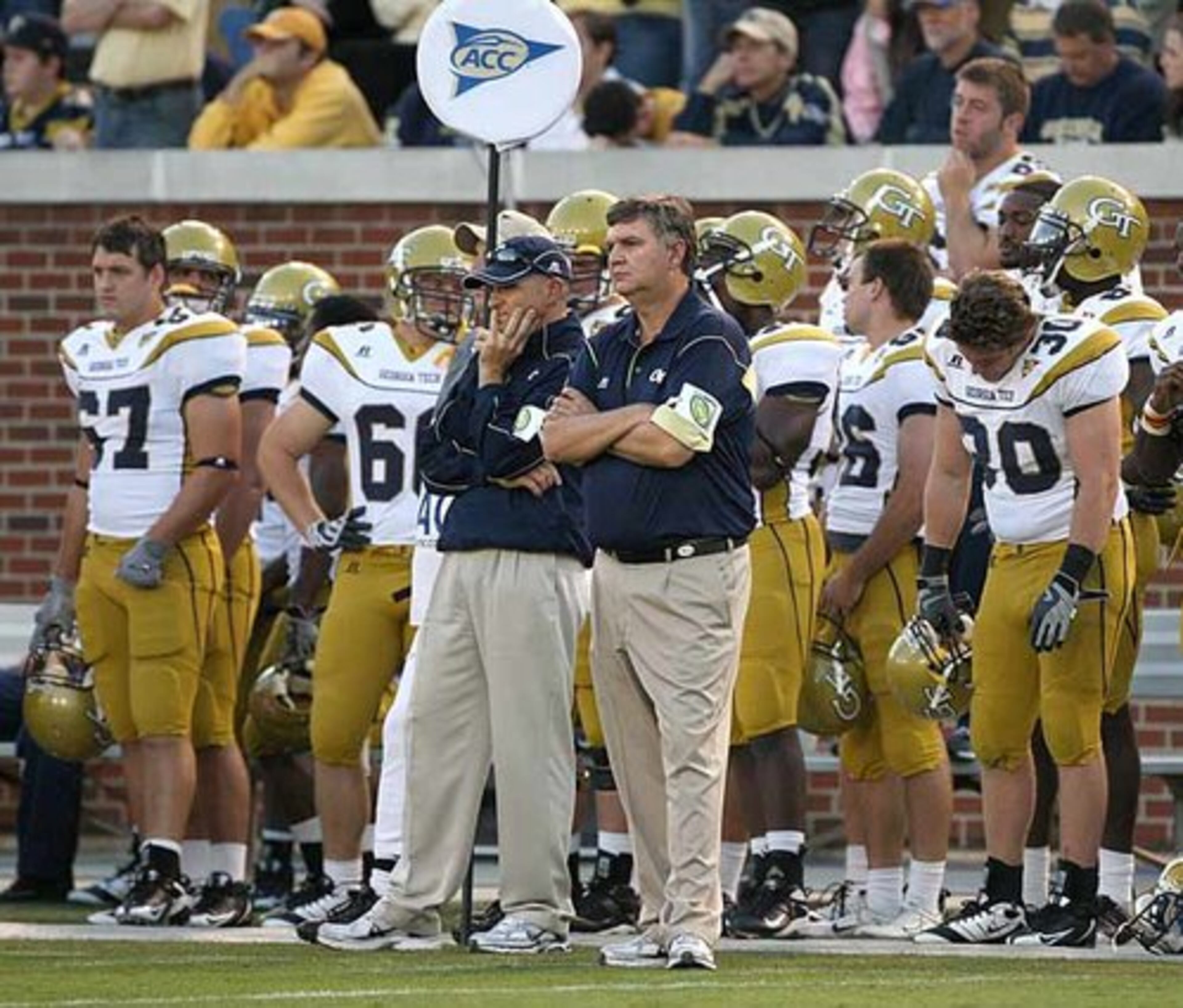 Georgia Tech's coach Paul Johnson and players watch as Virginia celebrates after intercepting a Josh Nesbitt pass in the final seconds of the fourth quarter.