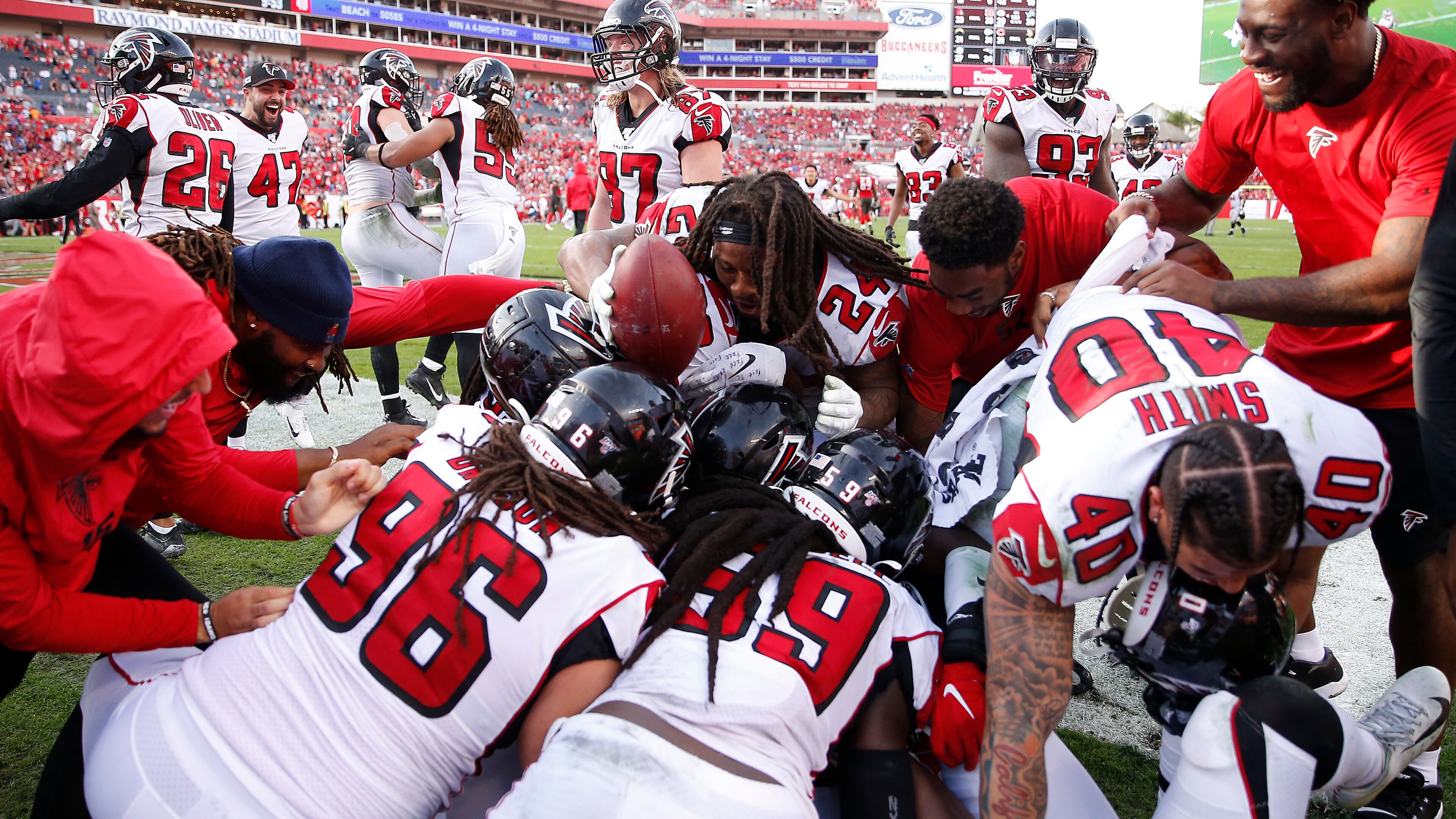 The Atlanta Falcons celebrate in the end zone after linebacker Deion Jones intercepted a Jameis Winston pass and ran in back for a touchdown to defeat the Tampa Bay Buccaneers 28-22 in overtime Sunday, Dec. 29, 2019, at Raymond James Stadium in Tampa, Fla.