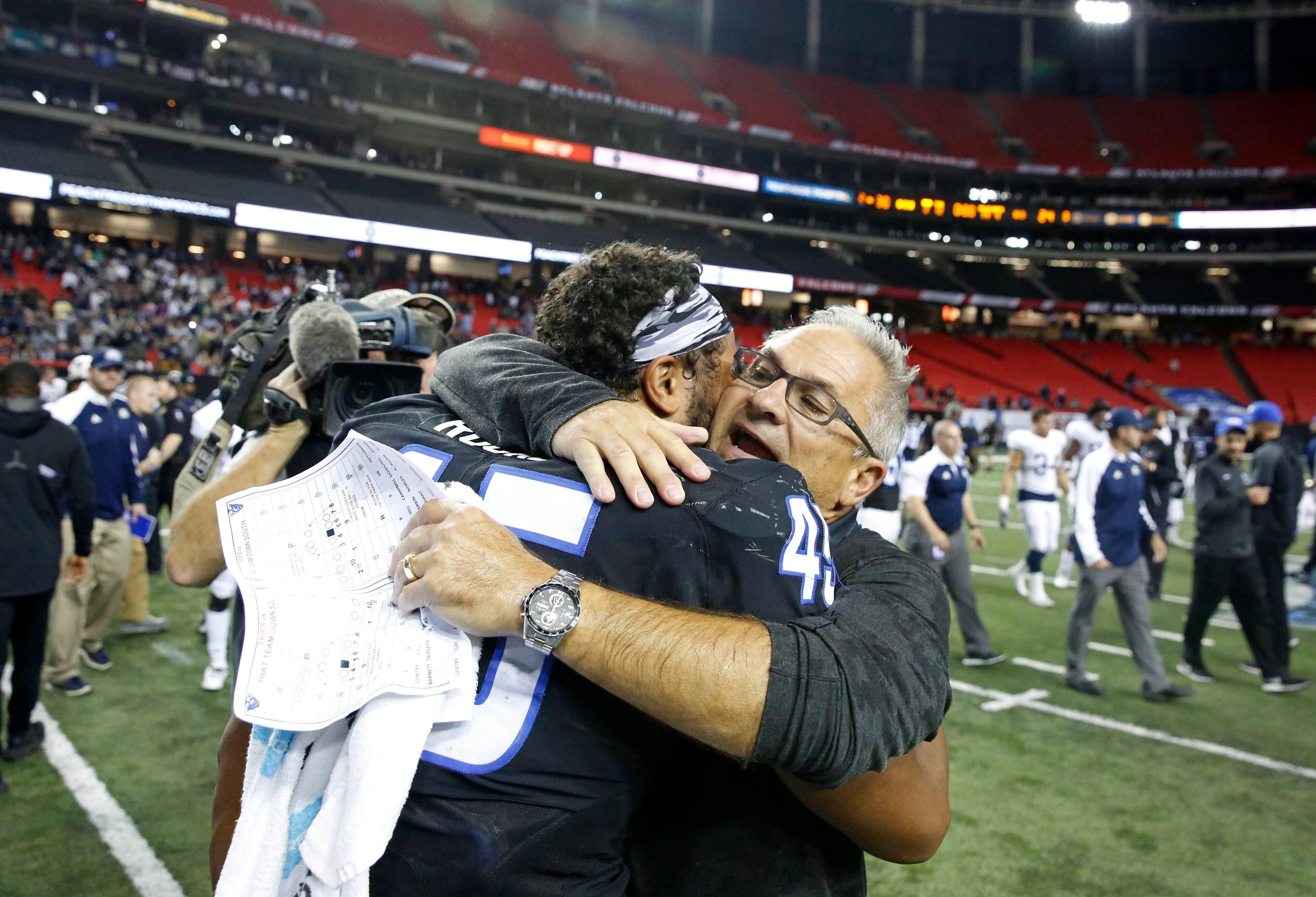 November 19, 2016 - Atlanta, Ga: Georgia State Panthers interim head coach Tim Lappano celebrates with tight end Keith Rucker (45) after their game against the Georgia Southern Eagles at the Georgia Dome Saturday November 19, 2016, in Atlanta, Ga. Georgia State won 30-24. PHOTO / JASON GETZ