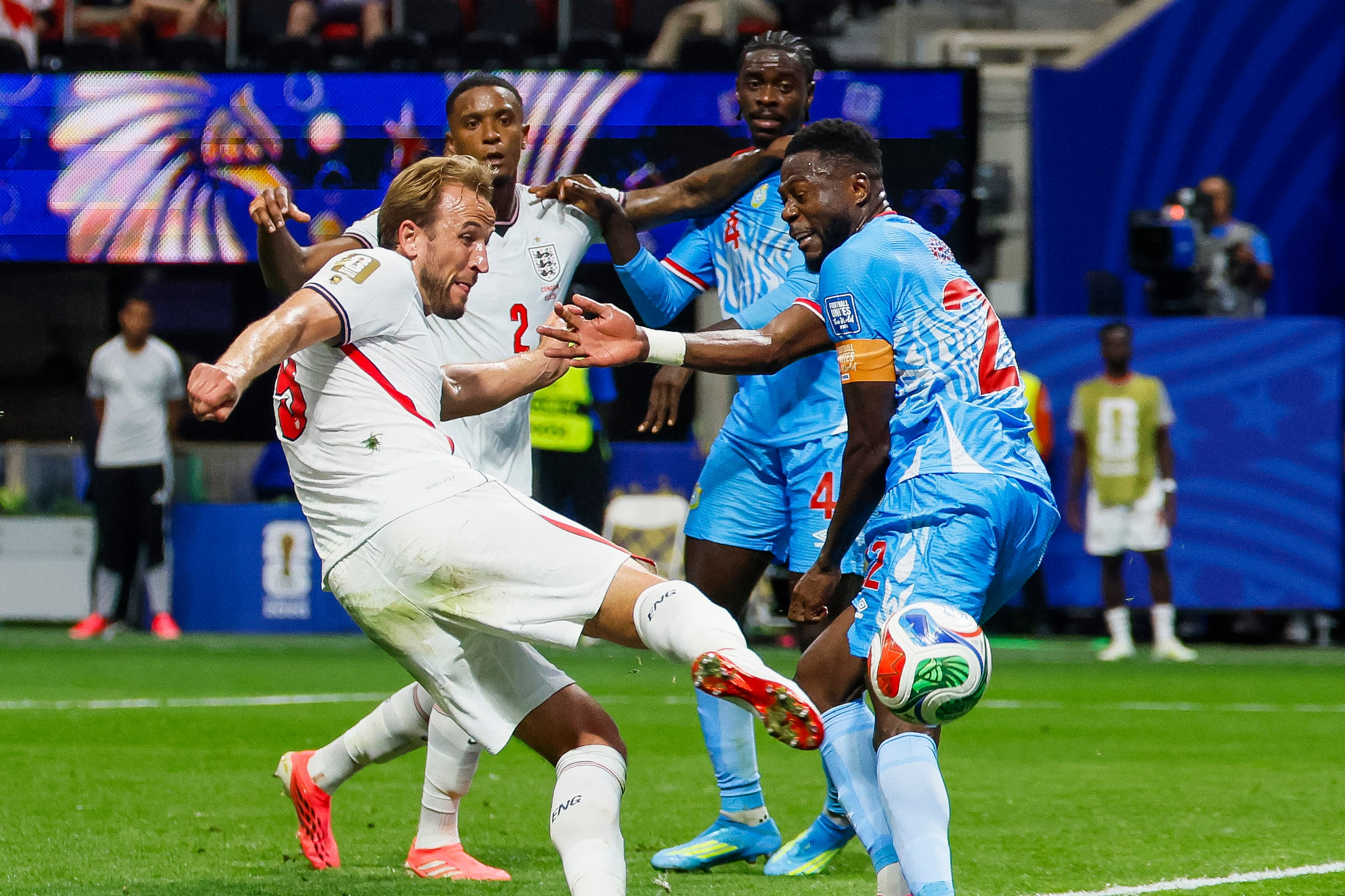 England forward Harry Kane (left) kicks toward the goal past Congo defender Aaron Wan-Bissaka (right) during the first half of a FIFA World Cup round of 32 match at Atlanta Stadium (Mercedes-Benz Stadium) on Wednesday, July 1, 2026, in Atlanta. (Miguel Martinez/AJC)