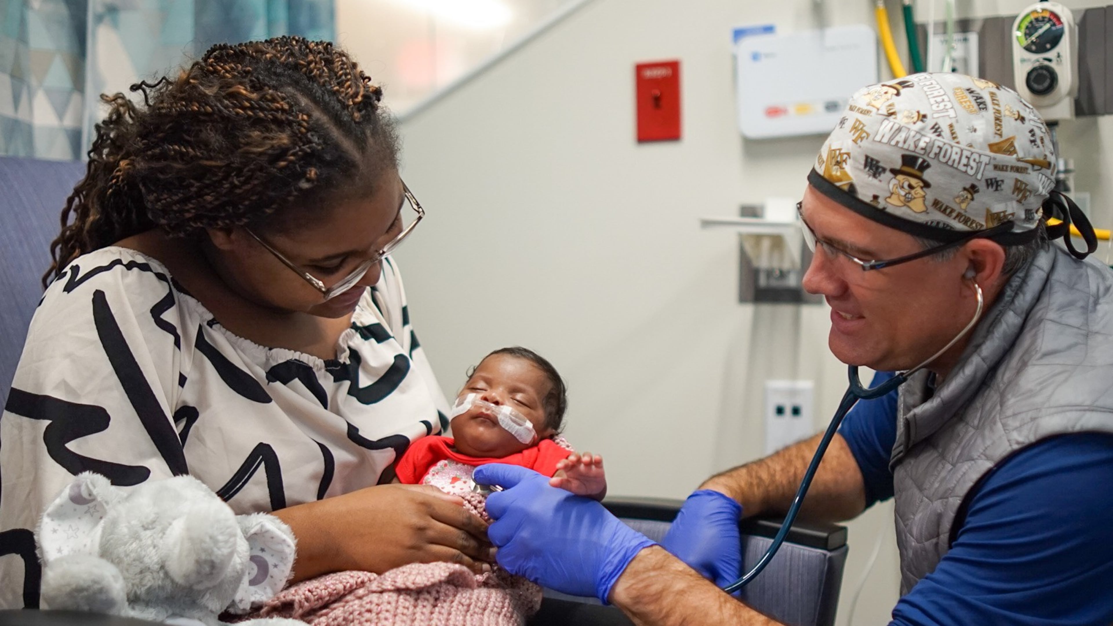 Dr. Brad Buckler examines Tianna Nunnally’s baby, Sky, at the Memorial Health University Medical Center’s Dwaine and Cynthia Willett Children’s Hospital neonatal intensive care unit in Savannah. (Courtesy of Tre Windom)