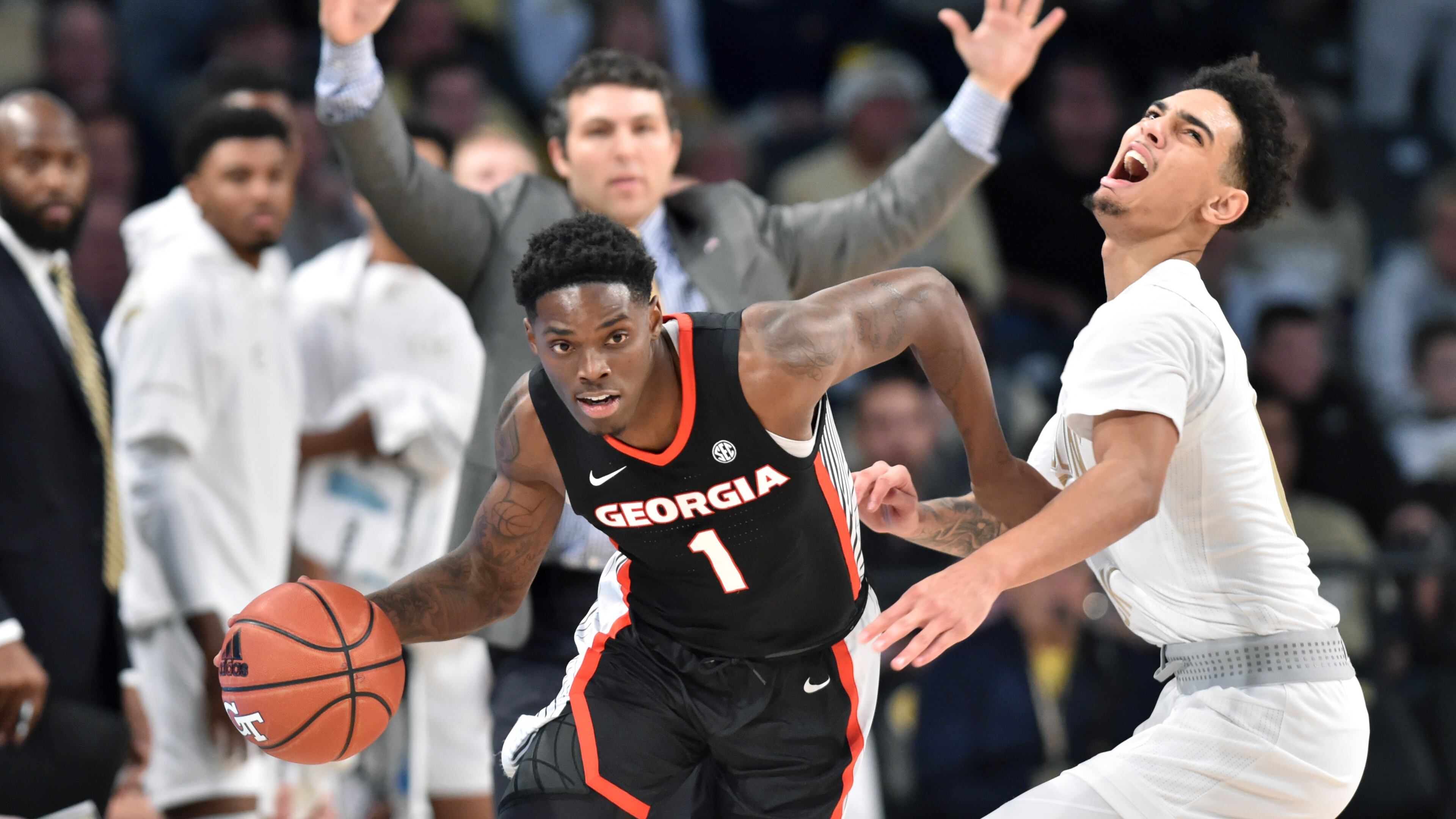 Georgia guard Teshaun Hightower (1) drives against Georgia Tech guard Michael Devoe (0) in the second half at Georgia Tech's McCamish Pavilion on Saturday, December 22, 2018. Georgia won 70-59 over the Georgia Tech. HYOSUB SHIN / HSHIN@AJC.COM