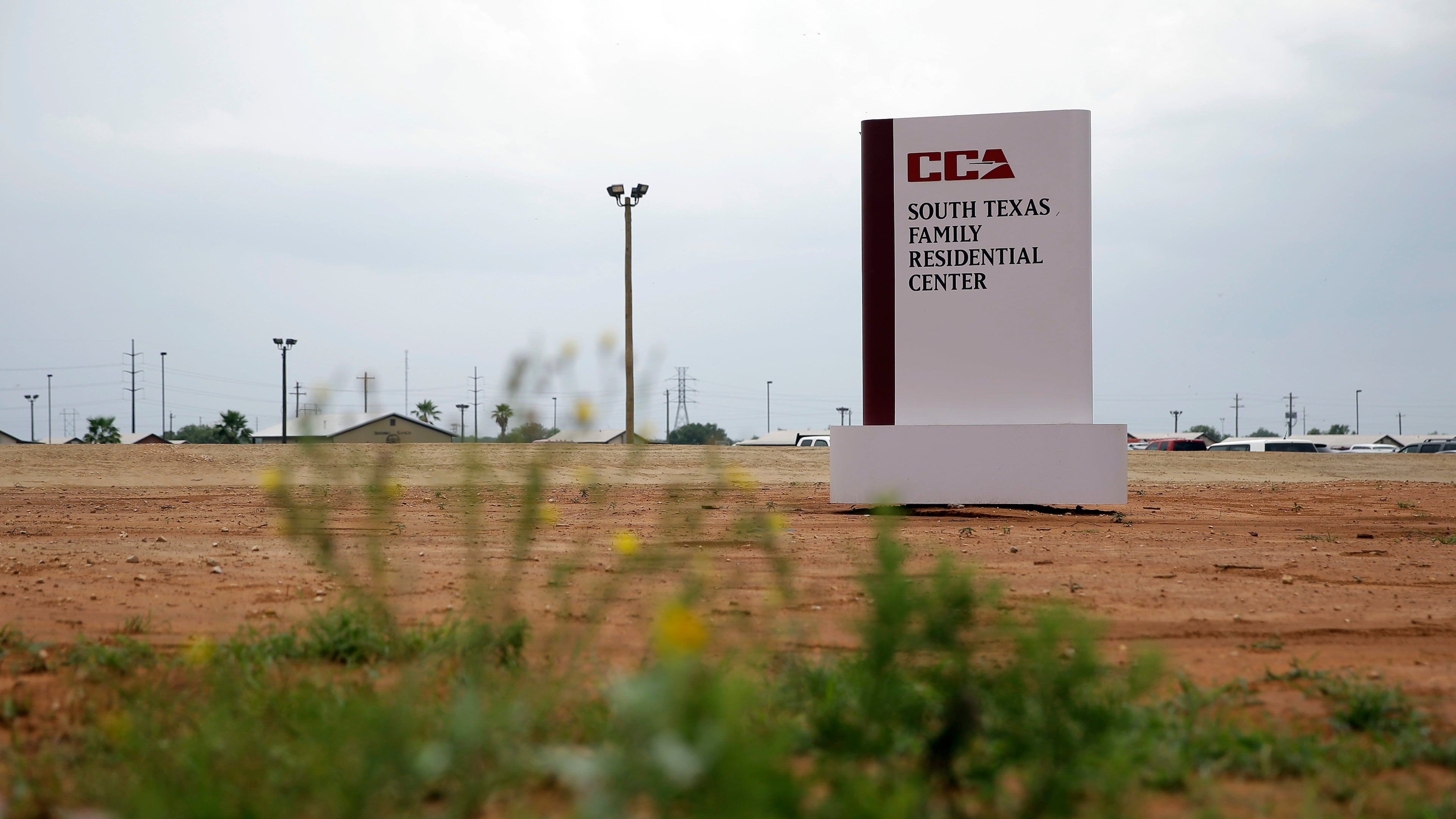 FILE - A sign stands at the entrance to the South Texas Family Residential Center in Dilley, Texas. (AP Photo/Eric Gay, File)