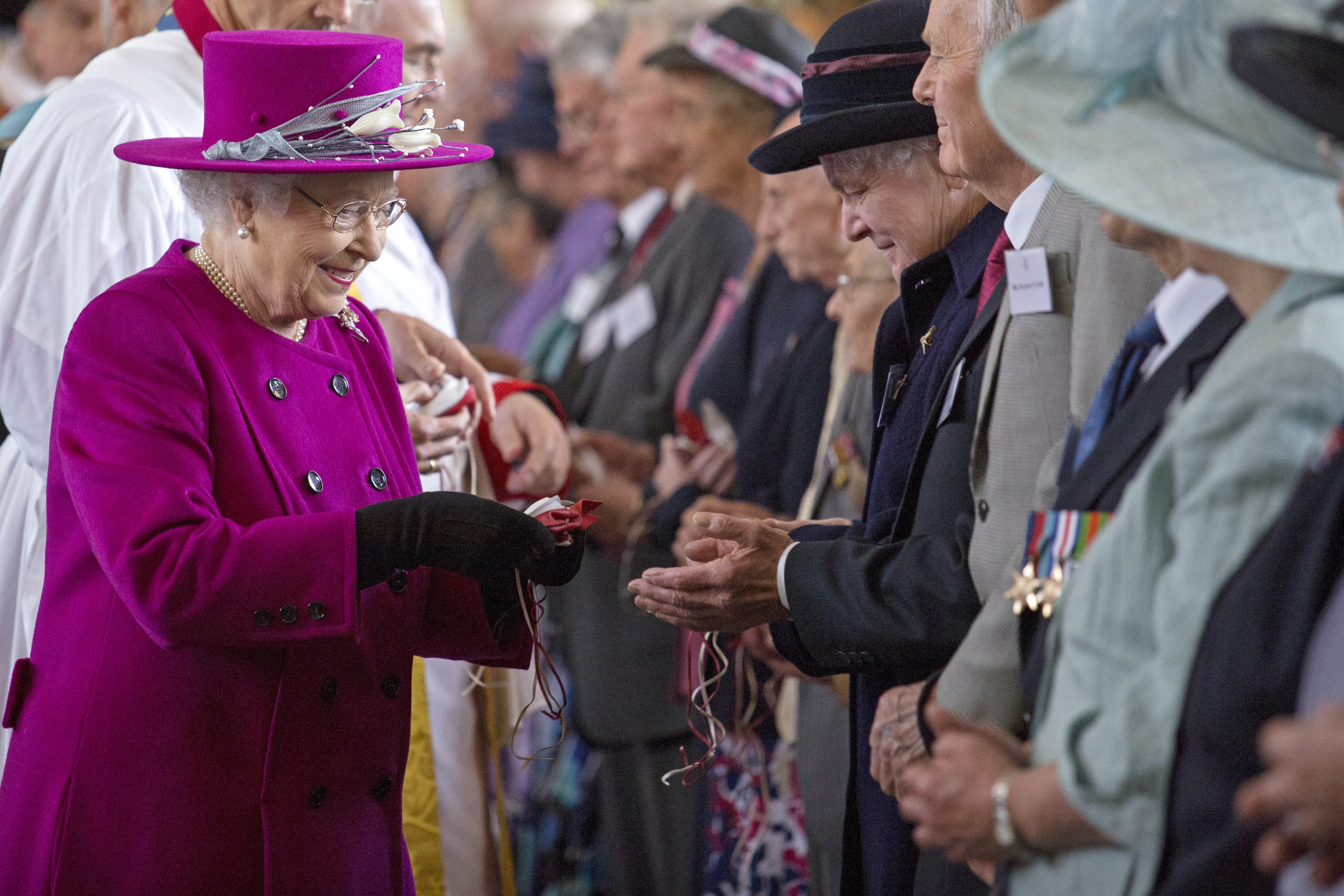 Queen Elizabeth II greets parishioners as she leaves Blackburn Cathedral after attending the Royal Maundy Service on April 17, 2014 in Blackburn, England. (Photo by Jack Hill - WPA Pool /Getty Images)