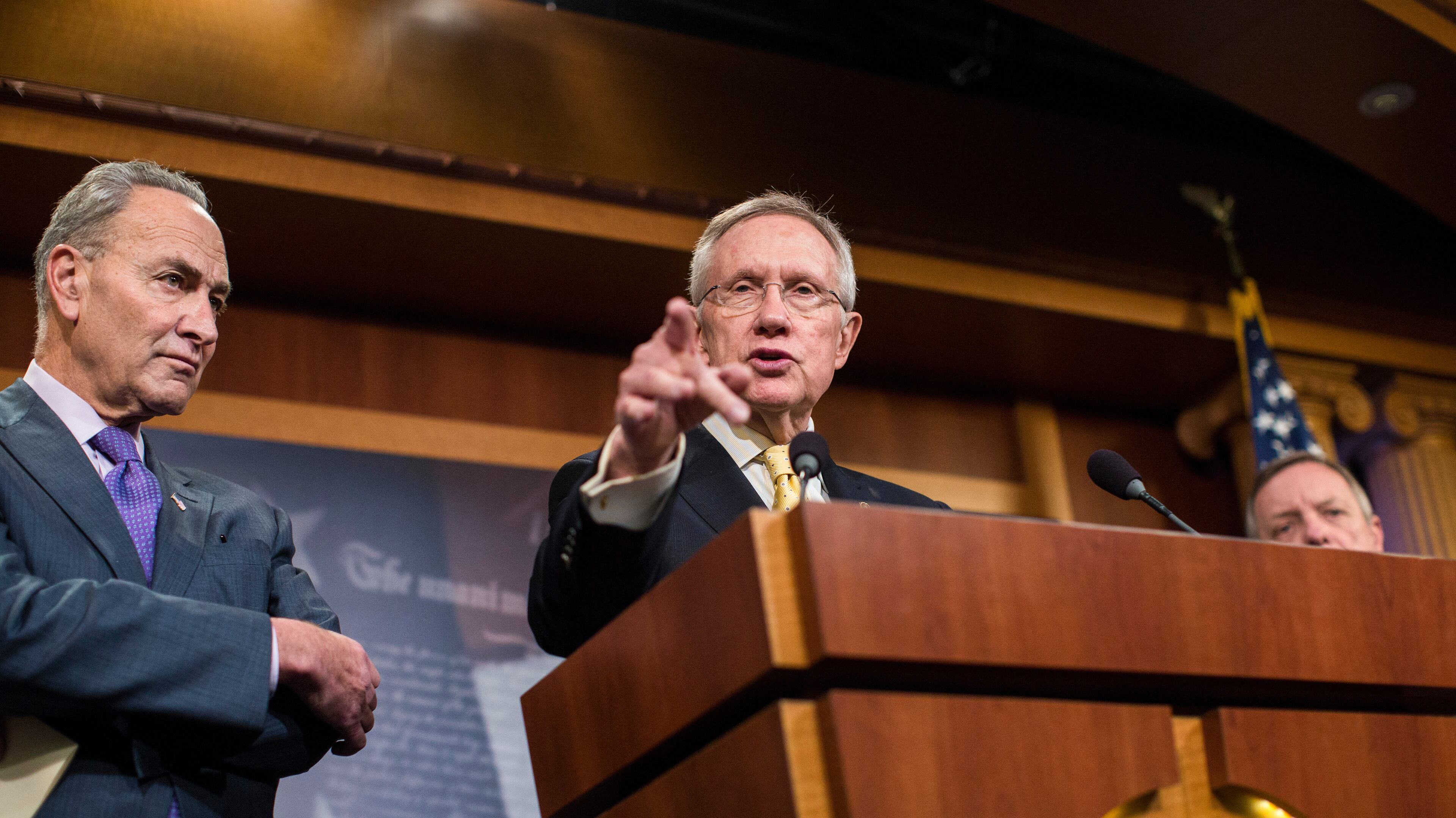 Senate Majority Leader Harry Reid (D-Nev.) speaks during a news conference about immigration as Sen. Chuck Schumer (D-N.Y.) looks on, on Capitol Hill in Washington, Nov. 20, 2014. President Barack Obama, in a speech to be broadcast Thursday evening, is set to lay out plans for using his executive authority in ways that could allow as many as 5 million undocumented people to come out of the shadows and into American society. (Jabin Botsford/The New York Times)