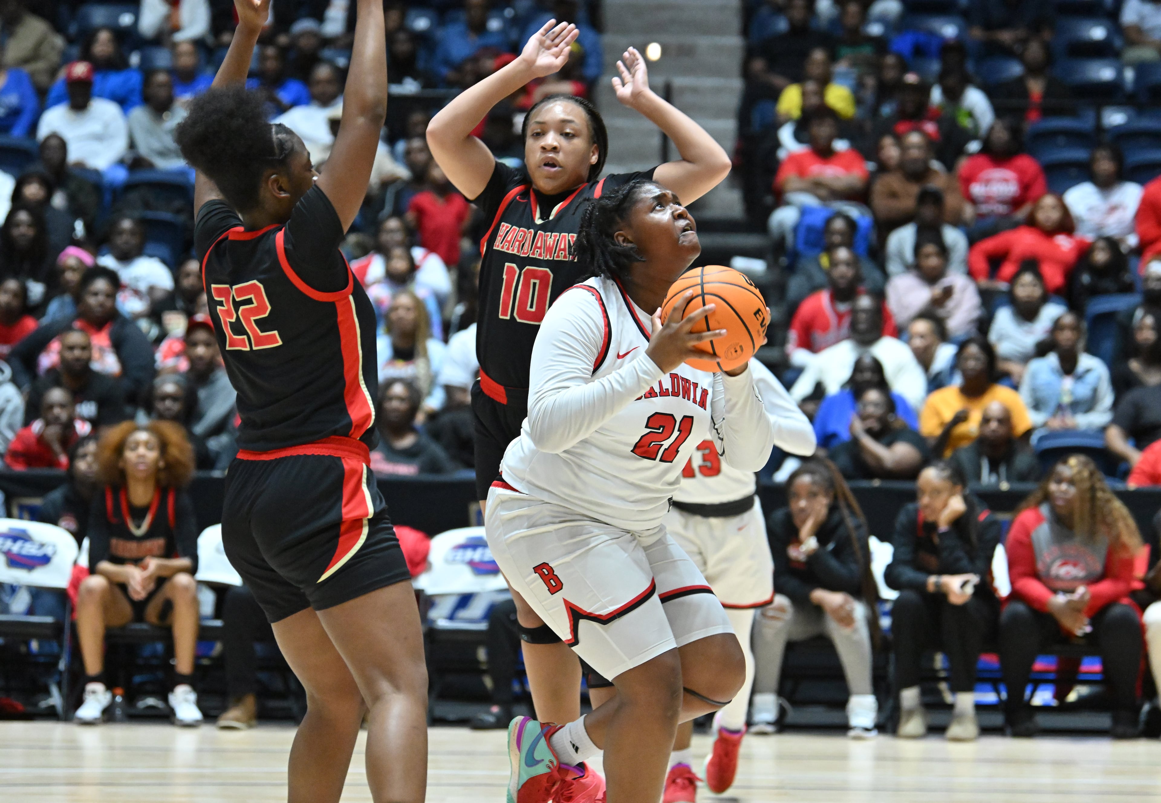 Baldwin’s Kassidy Neal (21) prepares to shoot during the first half of GHSA Basketball Class 4A Girl’s State Championship game at the Macon Centreplex, Wednesday, Mar. 6, 2024, in Macon. (Hyosub Shin / Hyosub.Shin@ajc.com)