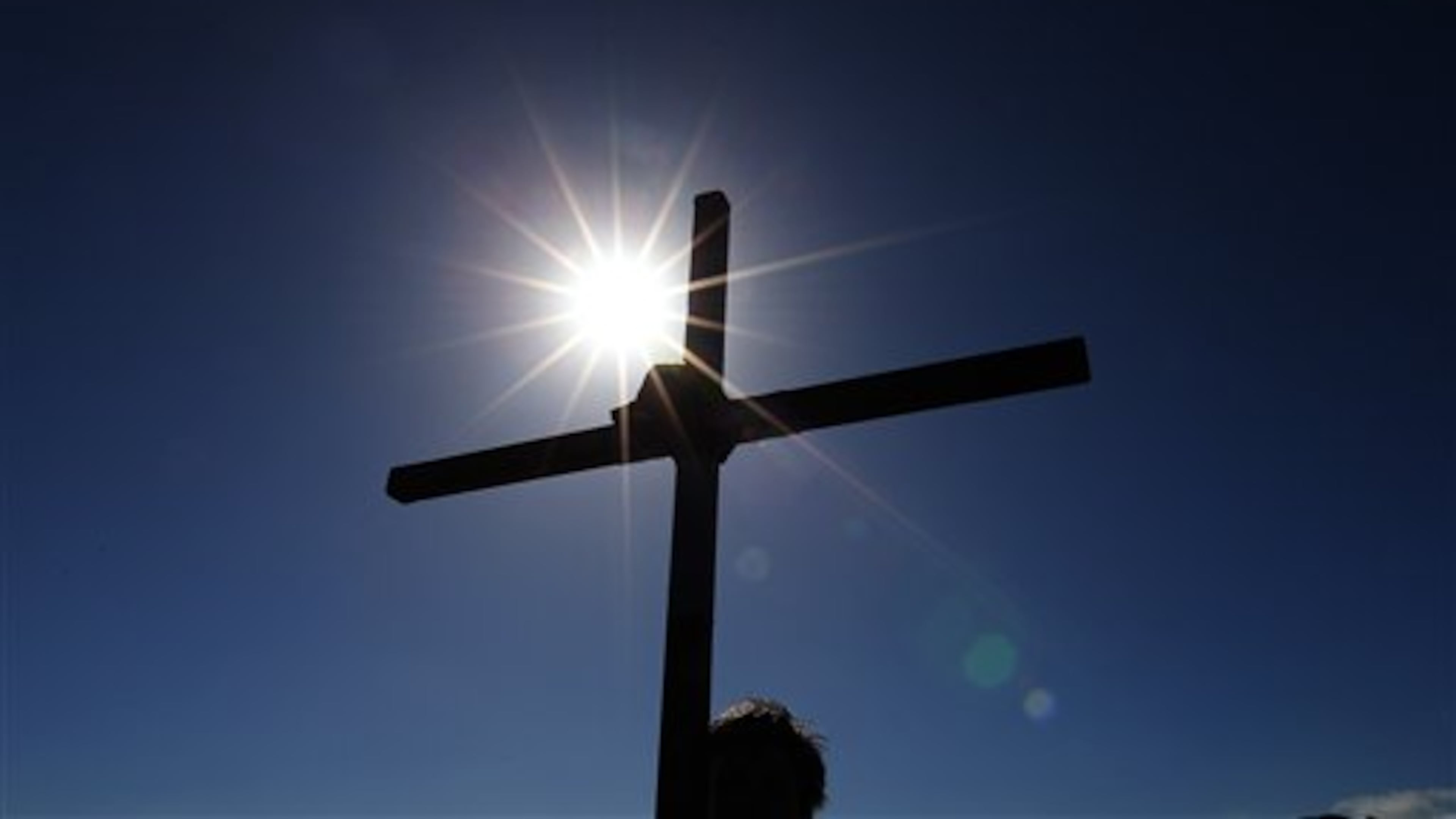 Pilgrims walk with crosses as the Northern Cross pilgrimage makes its final leg of the journey to Holy Island, Berwick Upon Tweed, England, Friday, April 18, 2014. For more than 30 years, groups of pilgrims celebrate Easter by crossing the tidal causeway during the annual Christian cross carrying pilgrimage to Holy Island , the pilgrims walk around 100 miles through Northumberland and the Scottish Borders during Holy Week. (AP Photo/Scott Heppell)