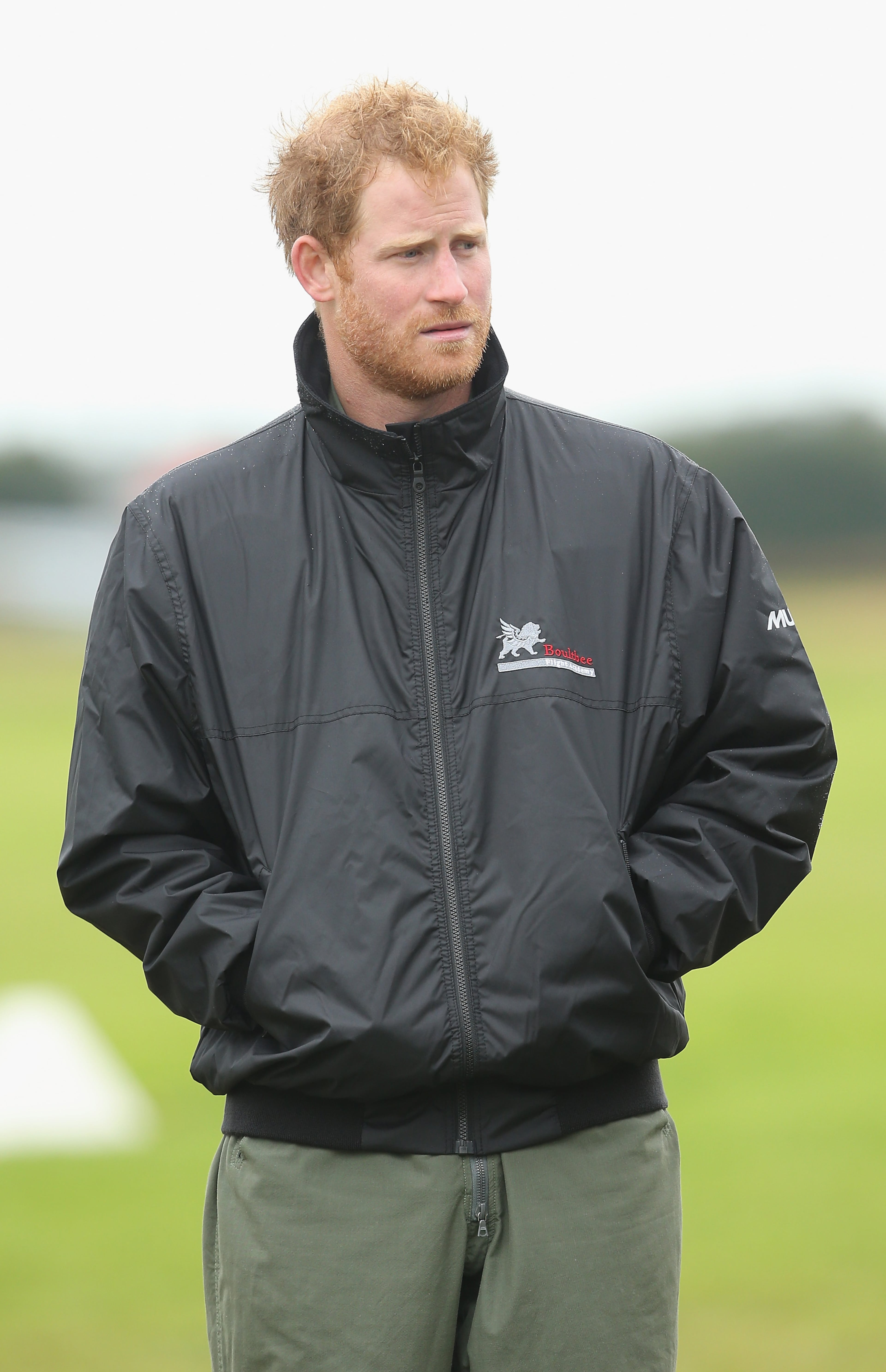 CHICHESTER, ENGLAND - SEPTEMBER 15: Prince Harry walks on the airfield at Goodwood Aerodrome as he is shown Spitfire Aircraft that will take place in a Battle of Britain Flypast at Goodwood on September 15, 2015 in Chichester, England. The 75th Anniversary of the Battle of Britain is being marked by a historic flypast that brings more Battle of Britain aircraft together than ever before as a show of thanks to 'the few' and the sacrifices they made. (Photo by Chris Jackson/Getty Images)