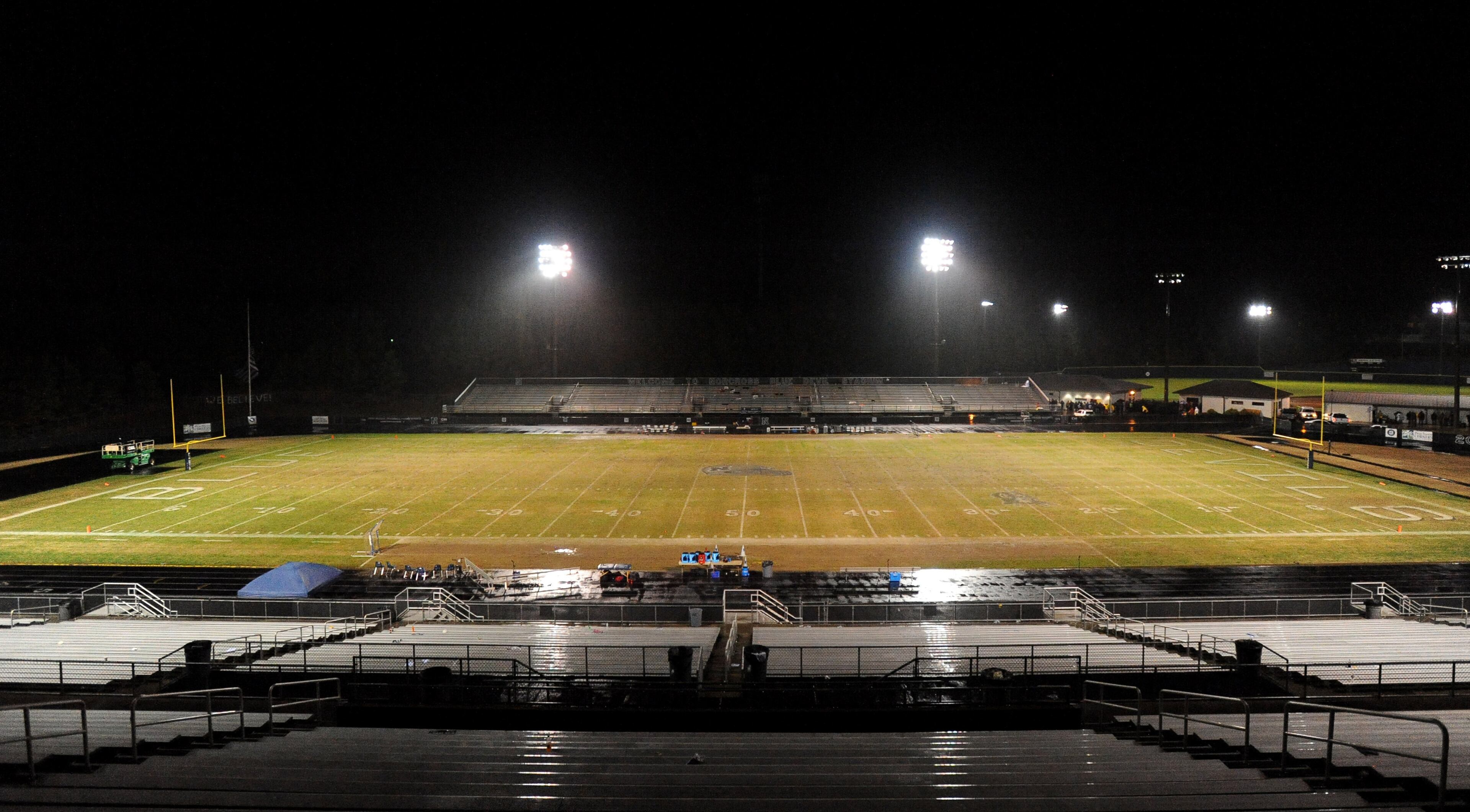 Blue Devil Stadium is empty in the second half of the AAAAAA semifinal game between Norcross and Colquitt County after time was called at 10:18 in the fourth quarter due to lightning in the area on Friday, Dec. 6, 2013, in Norcross, Ga.