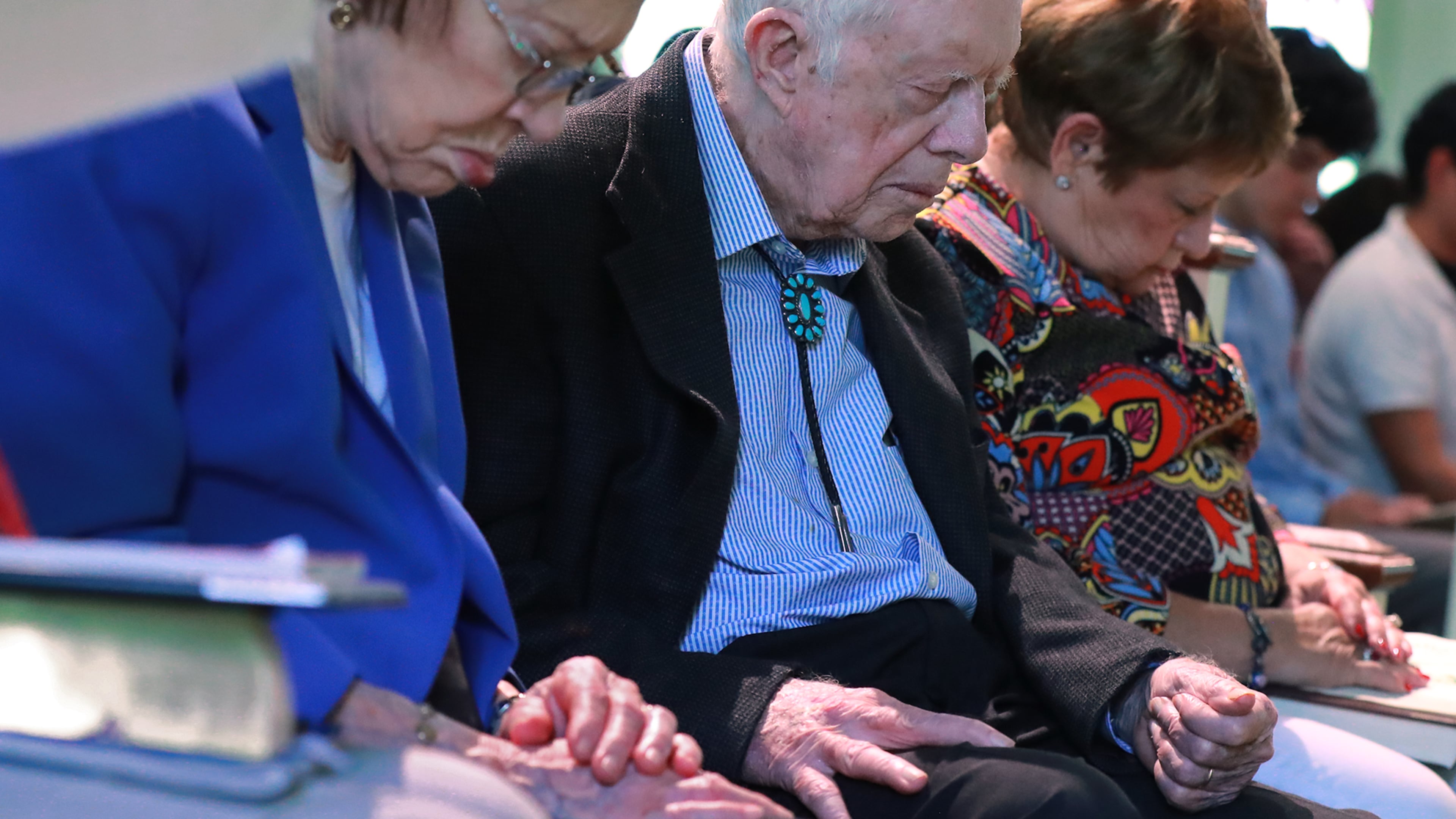 President Jimmy Carter and Rosalynn bow in prayer along with members and visitors during the worship service at Maranatha Baptist Church in Plains, Georgia on Sunday, June 9, 2019, less than a month after the 39th U.S. president and Plains native fell, breaking his hip. Curtis Compton/ccompton@ajc.com