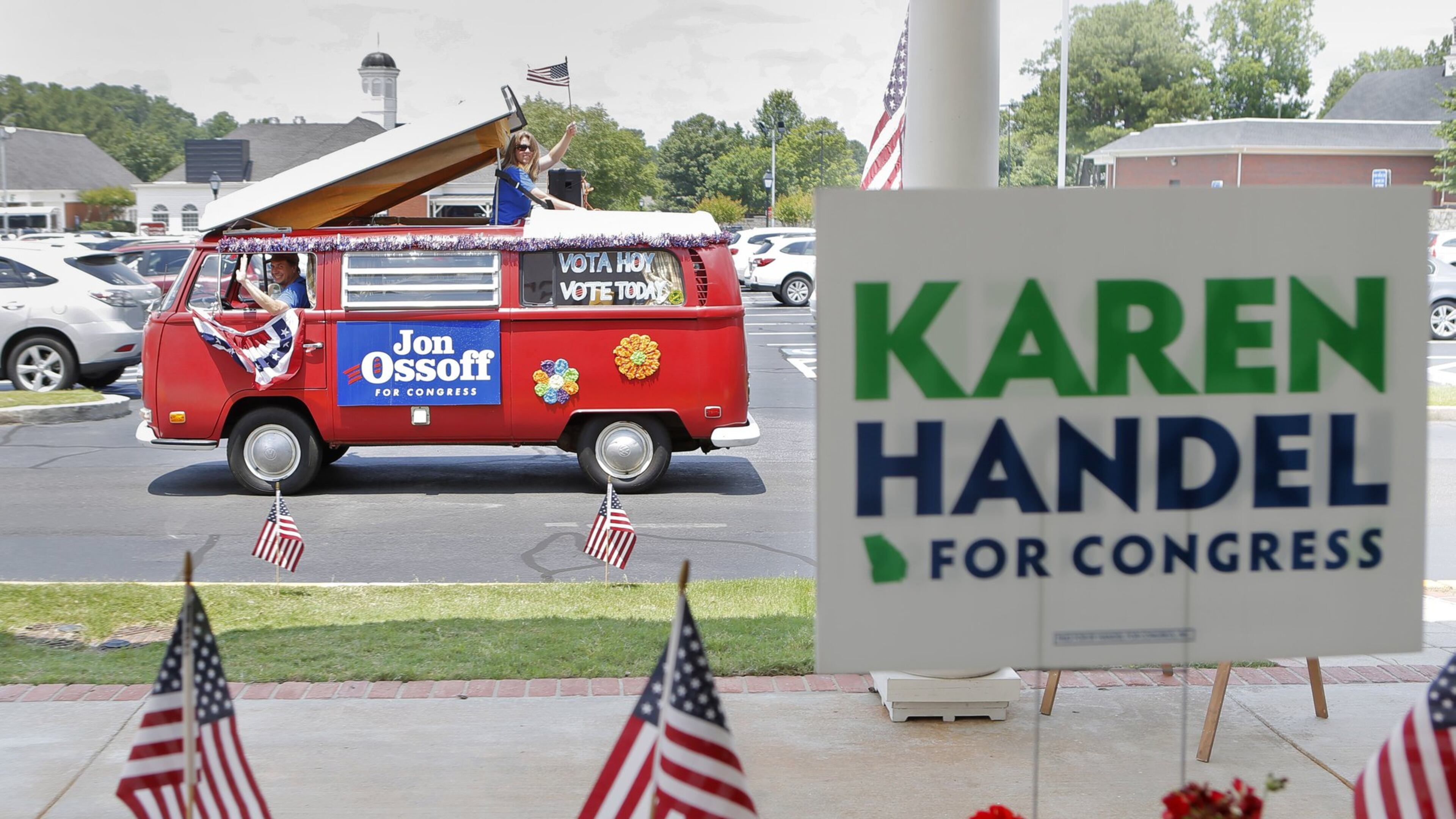 A campaign van for Jon Ossoff passes by a sandwich shop in Dunwoody where Karen Handel had just departed after greeting supporters there. Both are candidates in Georgia’s 6th Congressional District runoff election. BOB ANDRES /BANDRES@AJC.COM