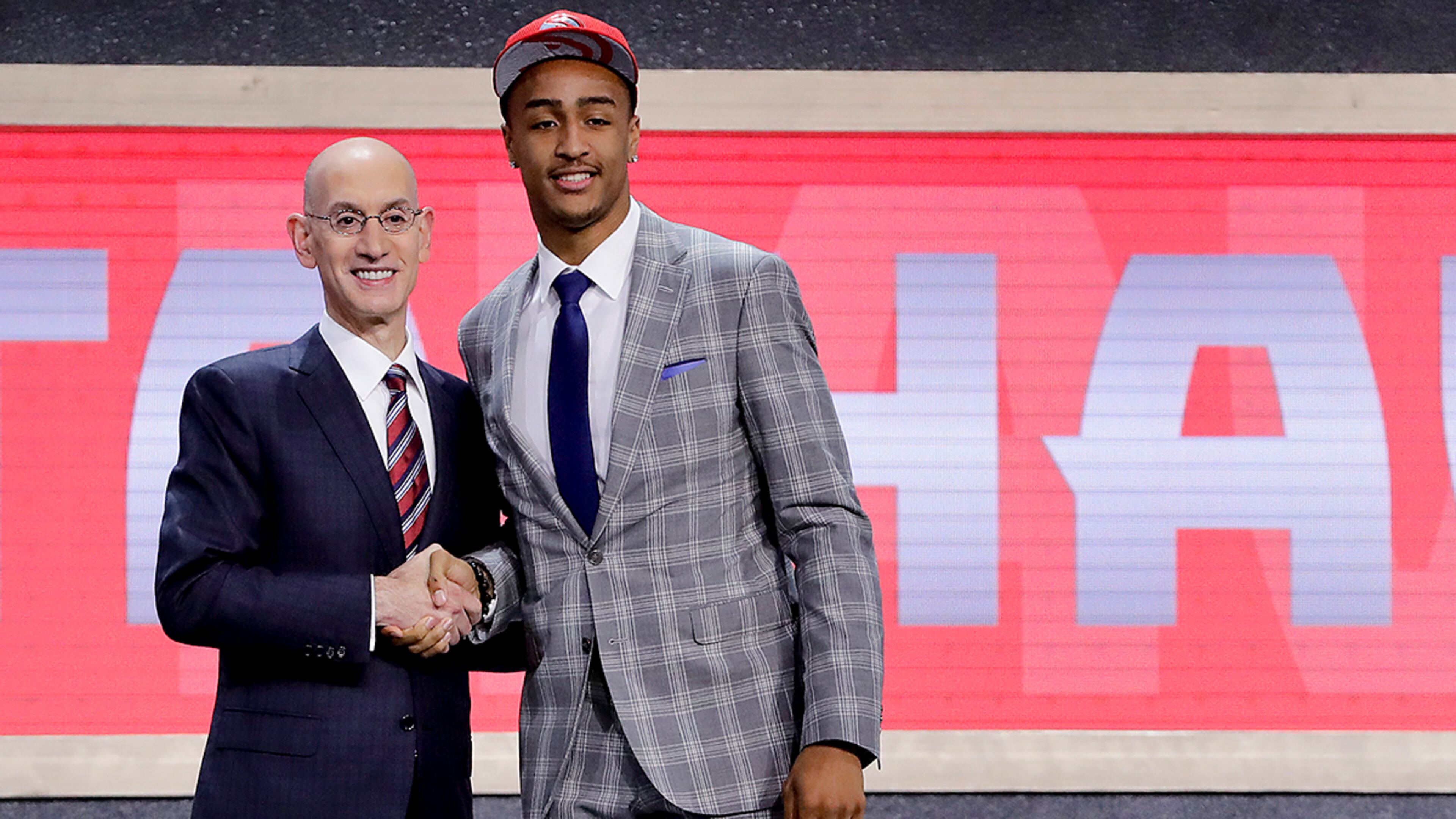 John Collins poses with NBA Commissioner Adam Silver after being selected by the Atlanta Hawks as the 19th pick overall during the NBA basketball draft, Thursday, June 22, 2017, in New York. (AP Photo/Frank Franklin II)