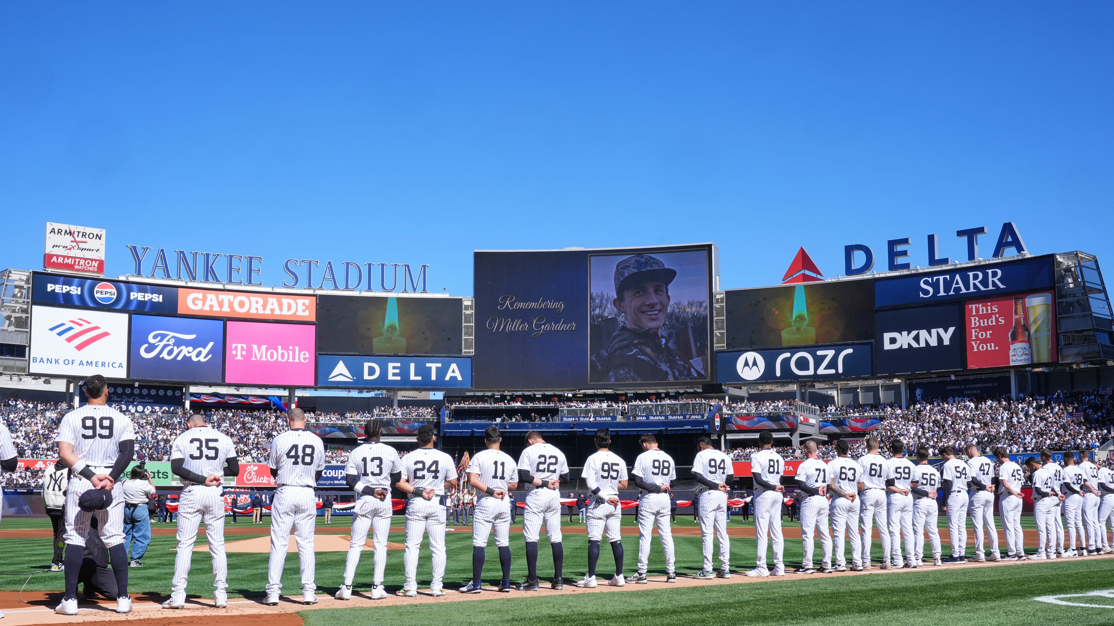 FILE - A moment of silence is observed for Miller Gardner, son of former New York Yankees player Brett Gardner, before the start of an opening-day baseball game between the Yankees and the Milwaukee Brewers at Yankee Stadium, March 27, 2025, in New York. (AP Photo/Seth Wenig, File)