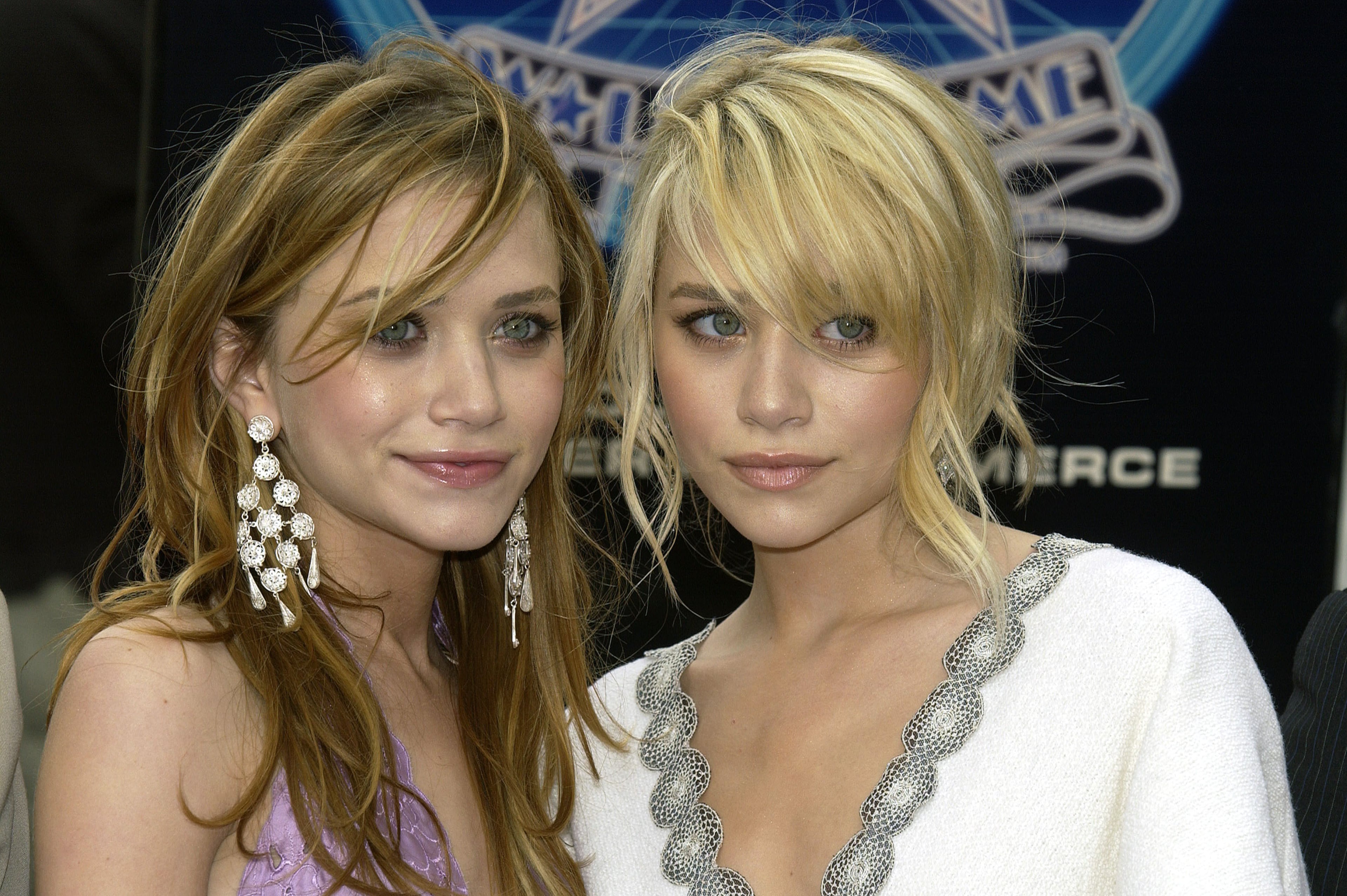 Actress twins Ashley (R) and Mary-Kate Olsen attend the ceremony honroing them with a star on the Hollywood Walk of Fame on April 29, 2004 in Hollywood, California. (Photo by Vince Bucci/Getty Images)