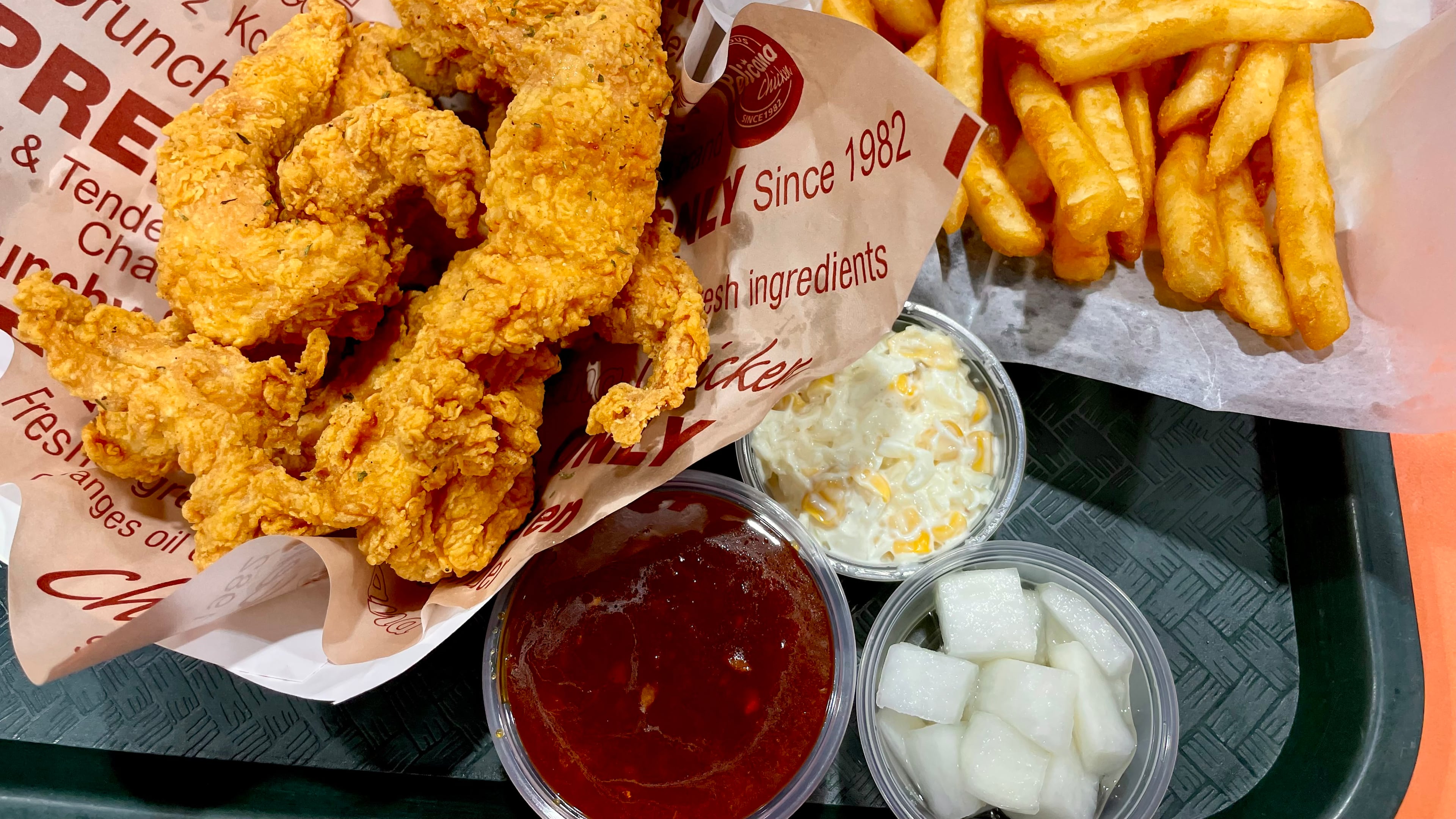 You can get a boneless version of crispy spicy fried chicken at Pelicana Chicken in H Mart. Angela Hansberger for The Atlanta Journal-Constitution