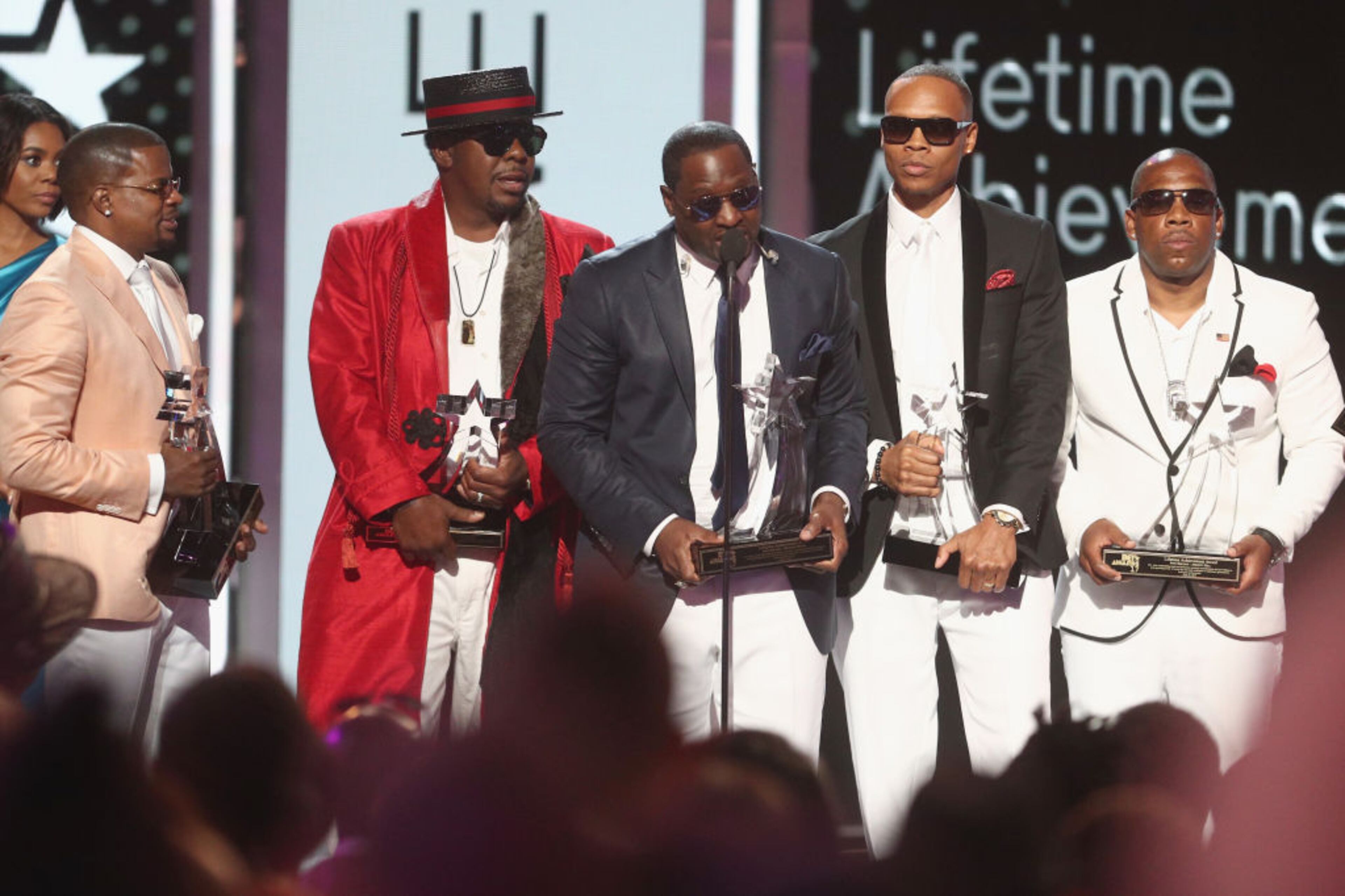 LOS ANGELES, CA - JUNE 25: (L-R) Ricky Bell, Bobby Brown, Johnny Gill, Ronnie DeVoe and Michael Bivins of New Edition accept the Lifetime Achievement Award onstage at 2017 BET Awards at Microsoft Theater on June 25, 2017 in Los Angeles, California. (Photo by Frederick M. Brown/Getty Images )