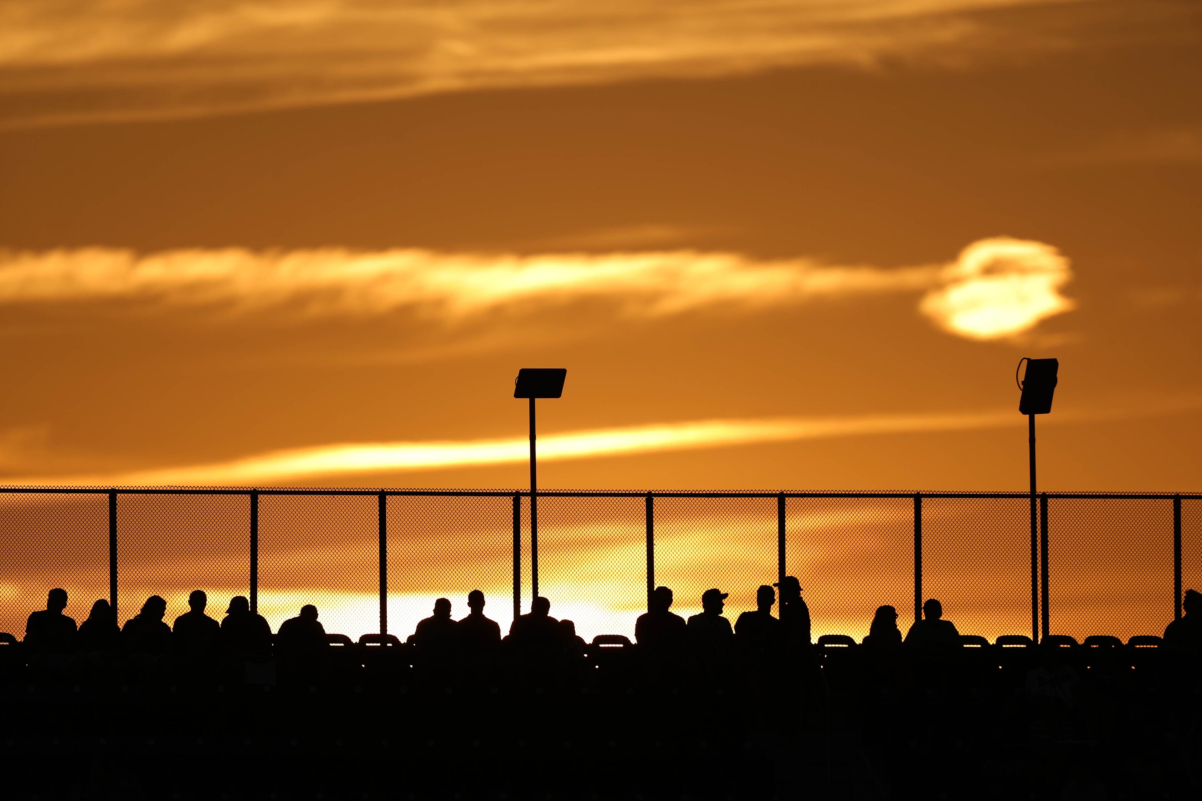 October 7, 2018 - Atlanta: The sun sets behind baseball fans before the start of Game 3 between the Atlanta Braves and the Los Angeles Dodgers in a National League Division Series baseball game Sunday, October 7, 2018, in Atlanta. (JASON GETZ/SPECIAL TO THE AJC)