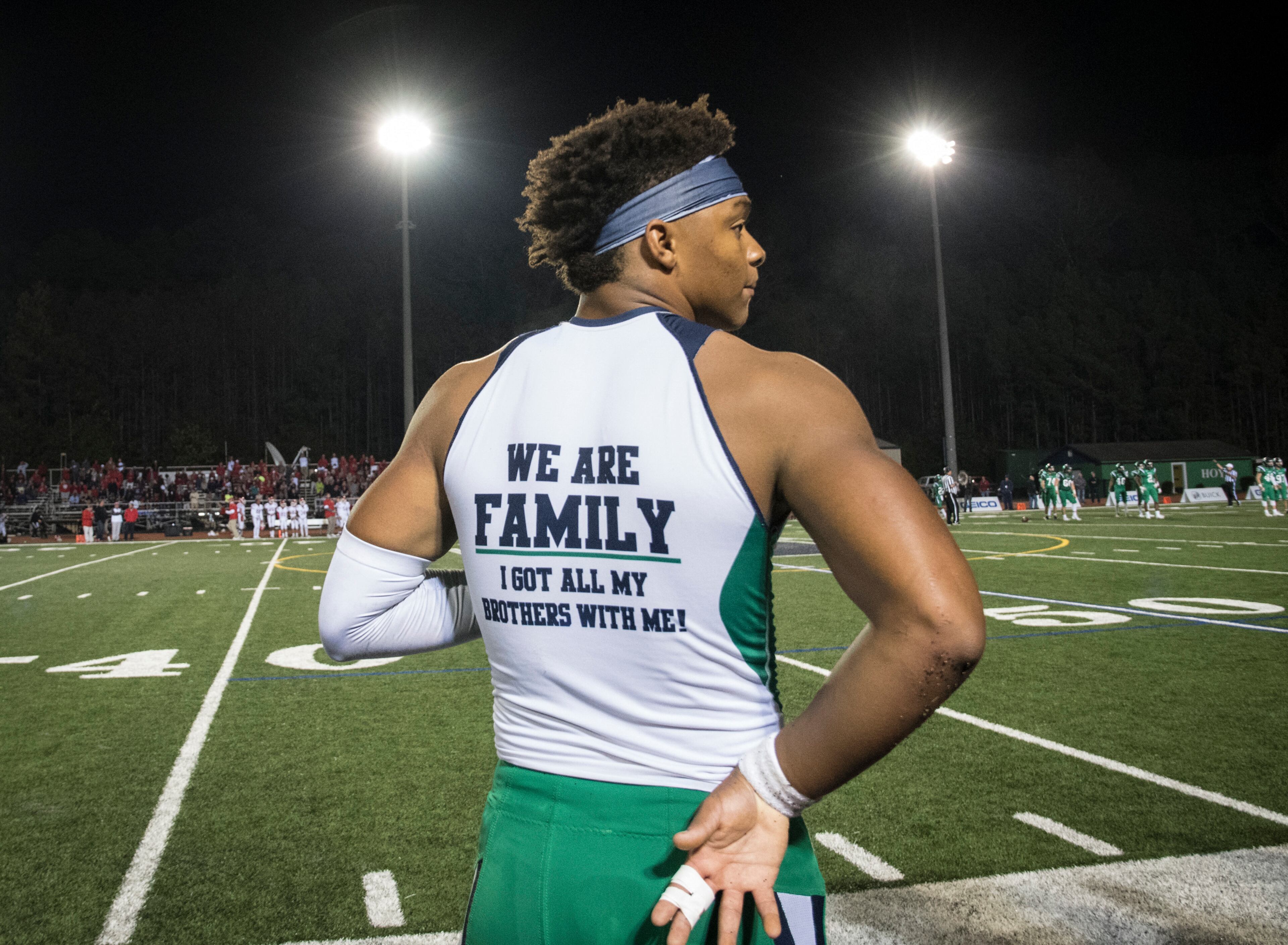 Harrison quarterback Justin Fields watches from the sideline after coming out of the football game against Dalton during the second half on Thursday, Oct. 19, 2017, in Kennesaw, Ga. (Special to the Atlanta Journal-Constitution, John Amis )