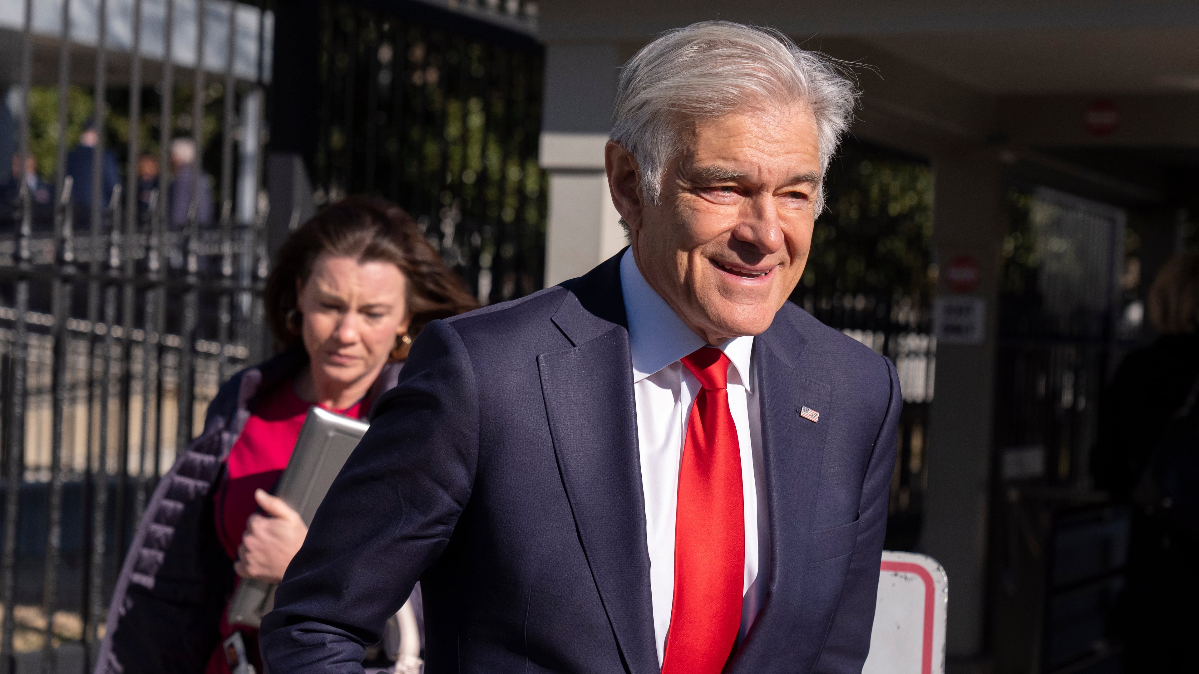 Dr. Mehmet Oz, administrator of the Centers for Medicare & Medicaid Services, leaves the White House campus, Thursday, Jan. 15, 2026, in Washington. (AP Photo/Mark Schiefelbein)