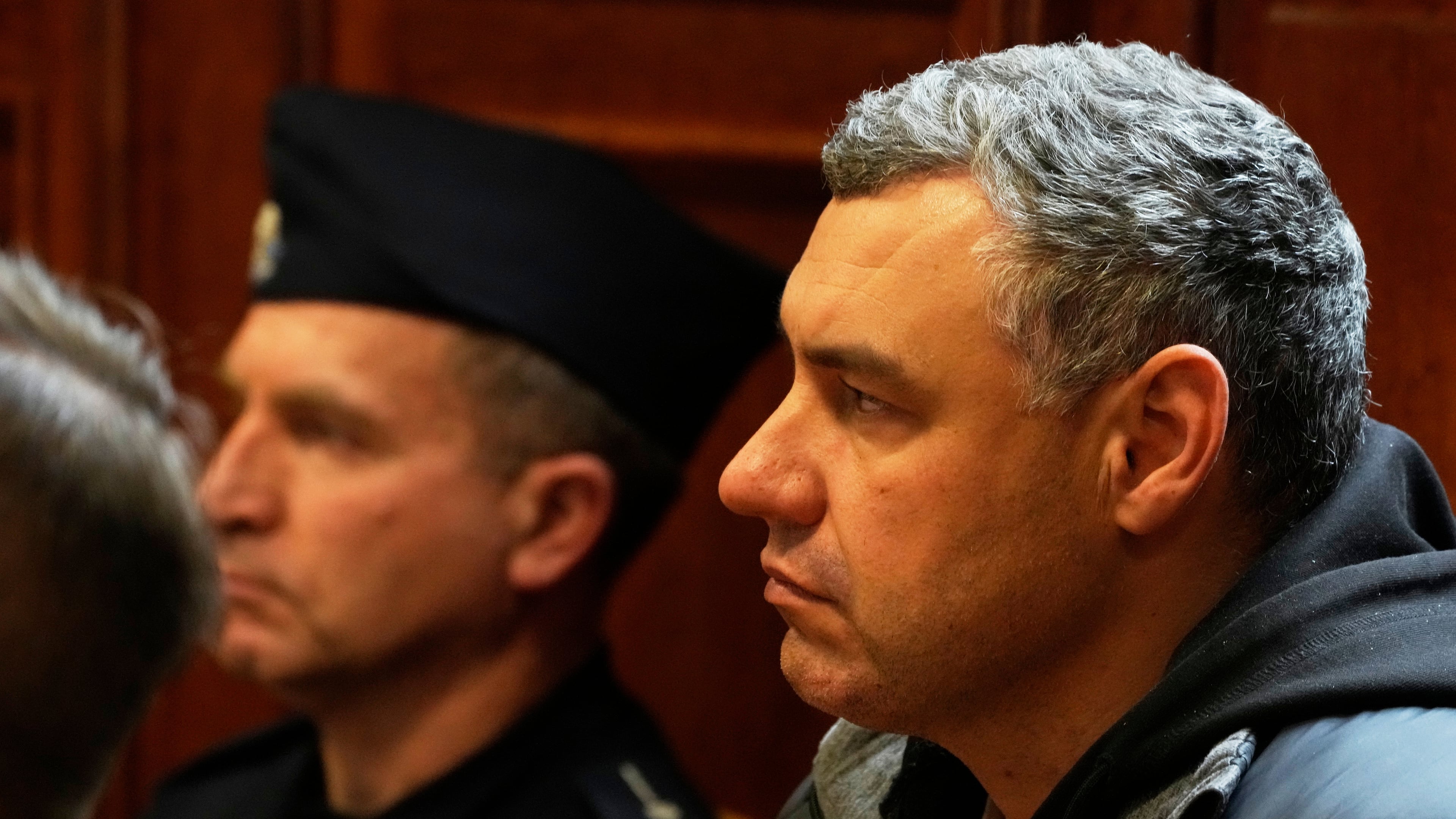 FILE - Ukrainian defendant Volodymyr Zhuravlov, right, listens as a judge announces the decision not to allow for extradition to Germany in courtroom of Warsaw's Regional Court in Warsaw, Poland, Friday, Oct. 17, 2025. (AP Photo/Czarek Sokolowski, File)