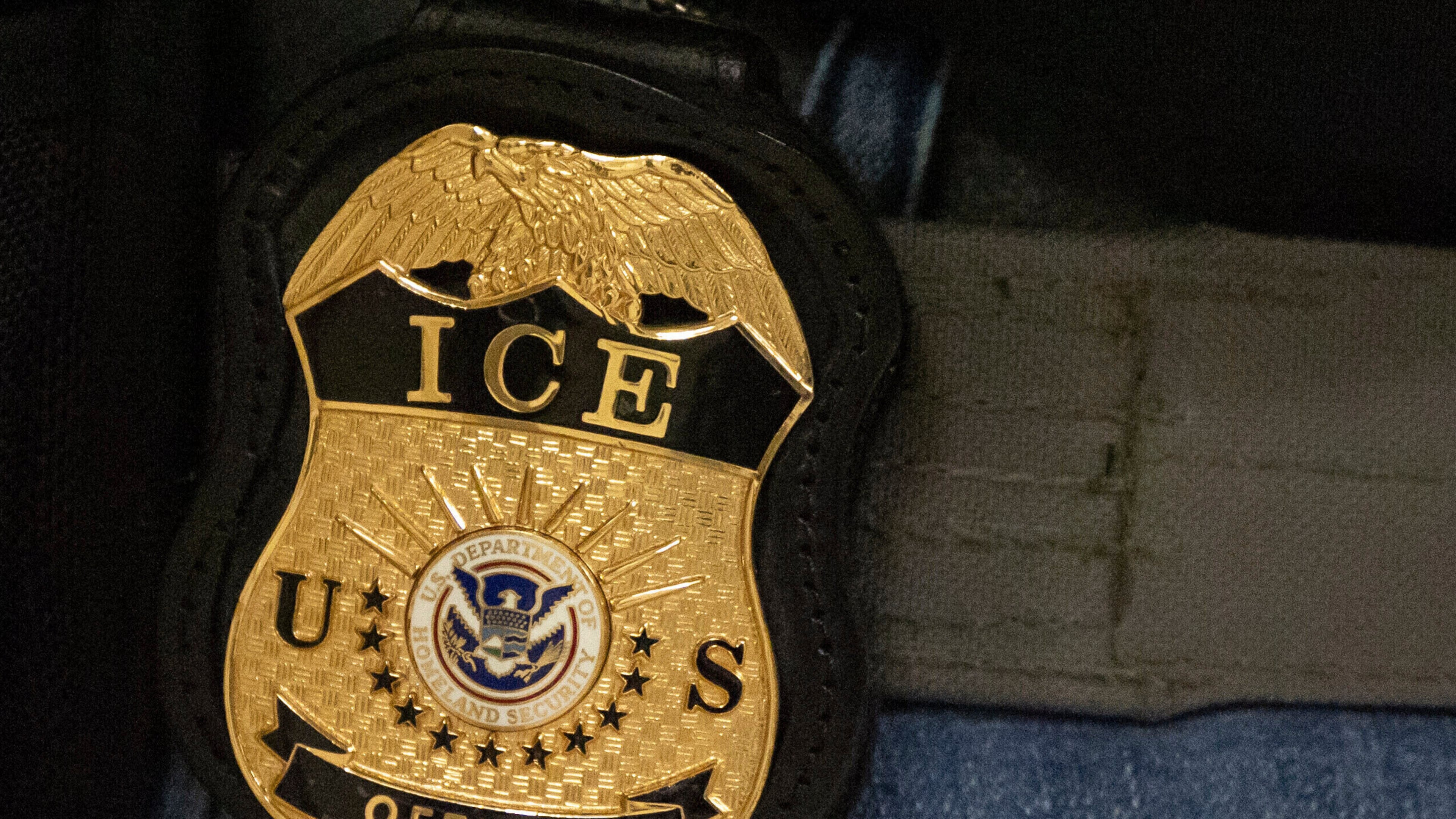 FILE - A federal agent wears an Immigration and Customs Enforcement badge in New York, June 10, 2025. (AP Photo/Yuki Iwamura, File)