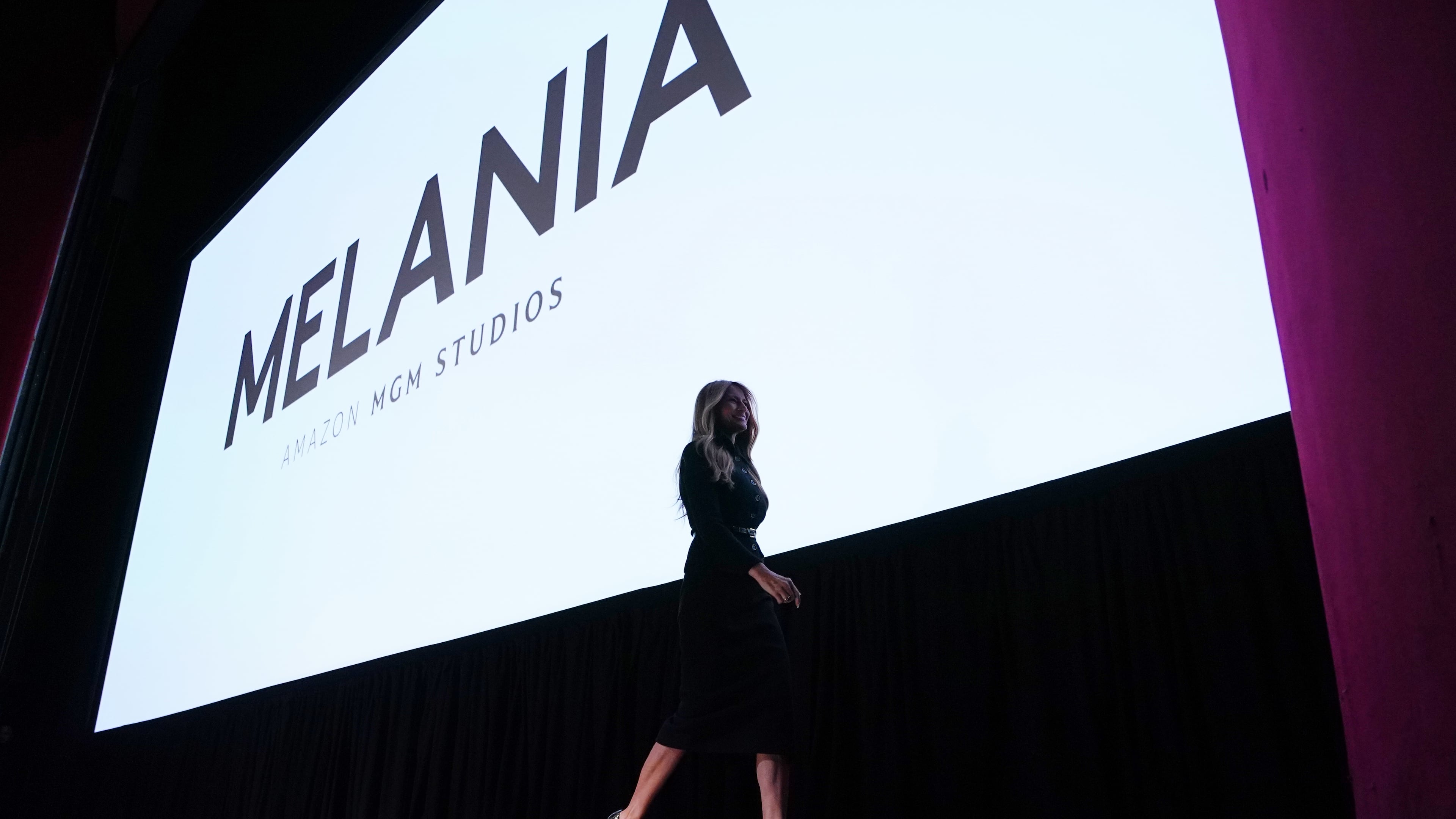 First lady Melania Trump walks from the stage after speaking before the premiere of her movie "Melania" at The John F. Kennedy Memorial Center For The Performing Arts, Thursday, Jan. 29, 2026, in Washington. (AP Photo/Allison Robbert)